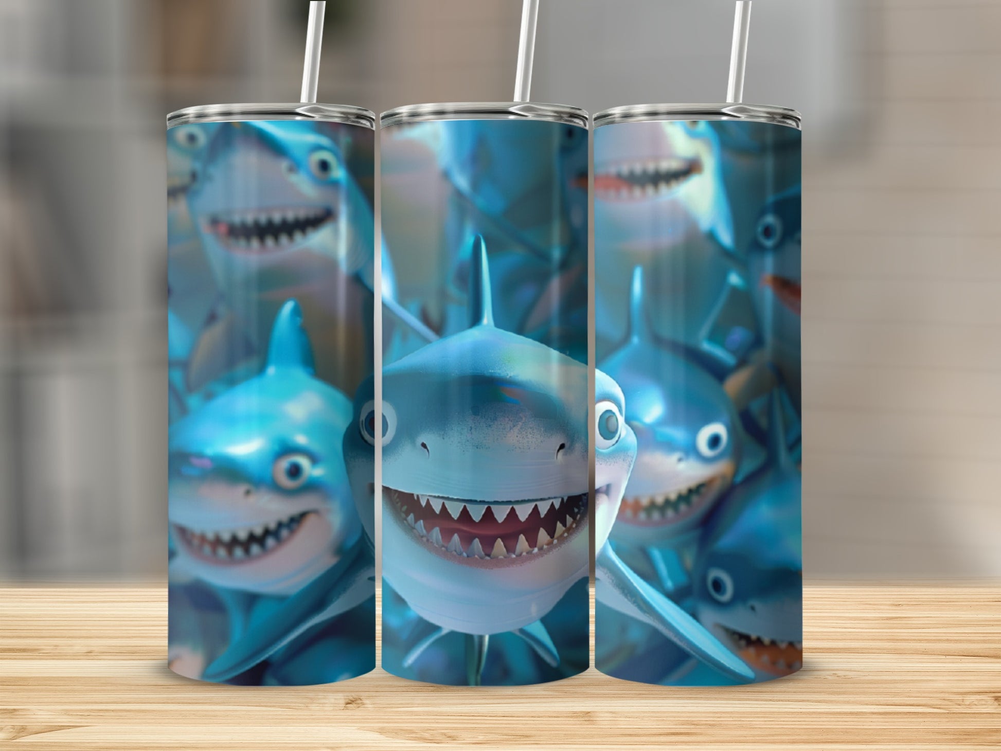 Three tumblers featuring cartoon sharks with wide smiles and sharp teeth.