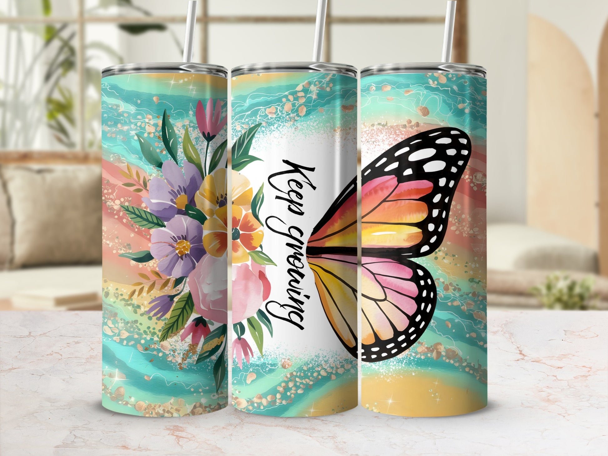 Three tumblers with floral designs and a butterfly with "Keep Growing" text.