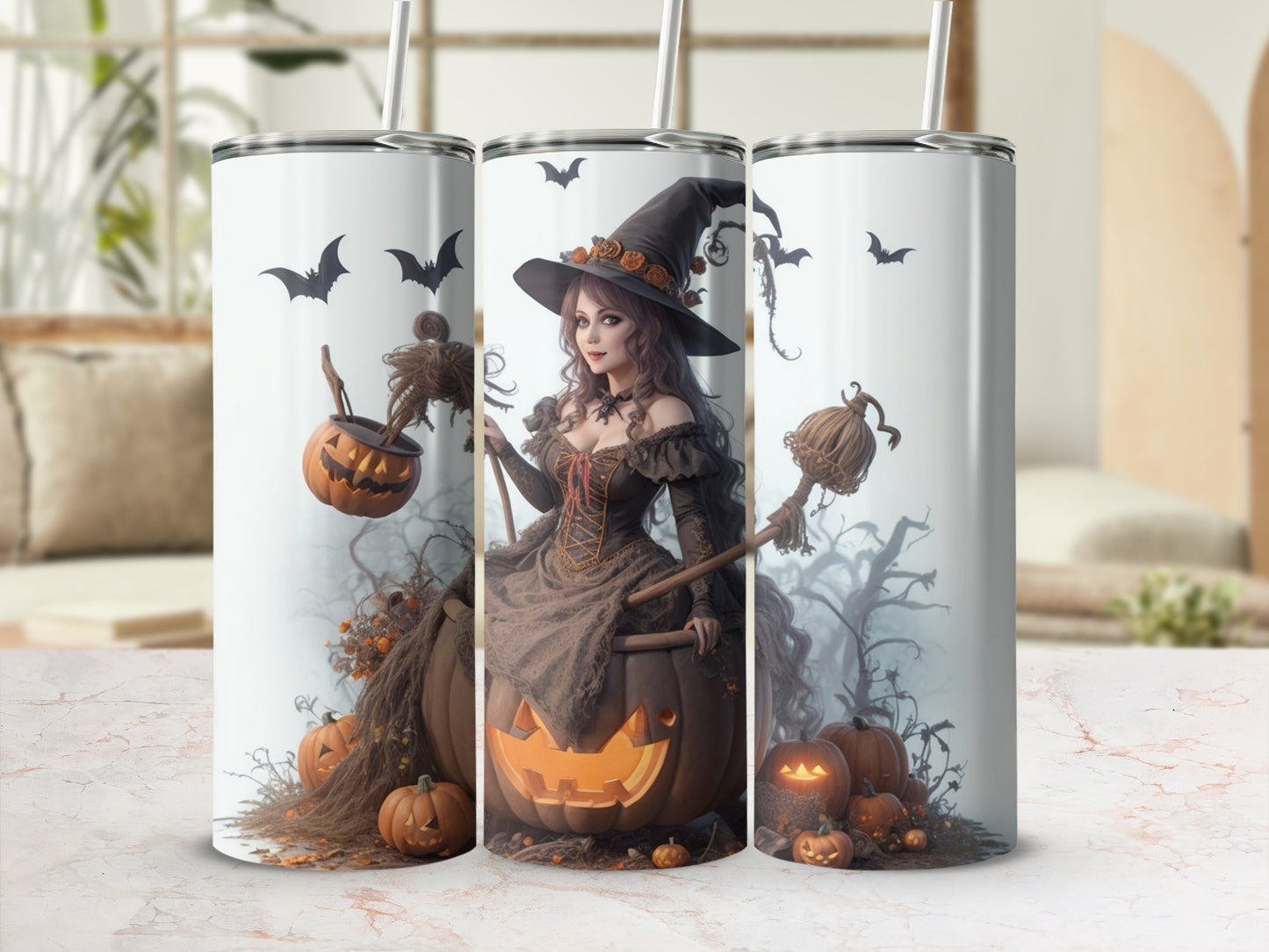 Three tumblers feature a Halloween design with a witch, pumpkins, and bats.