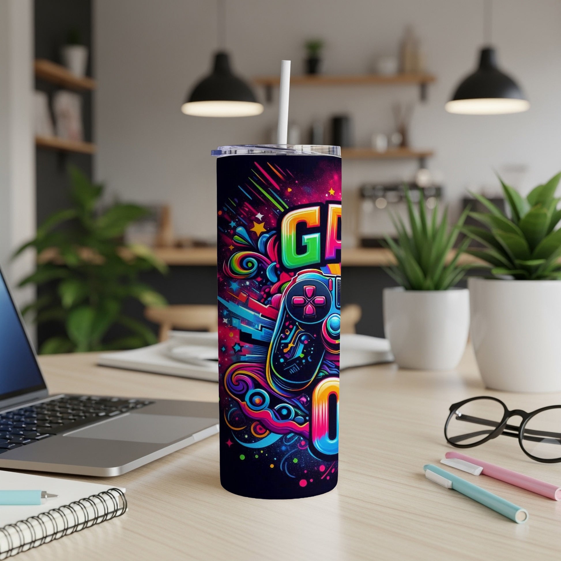 Colorful "GAME ON" text and controller design on a dark tumbler.