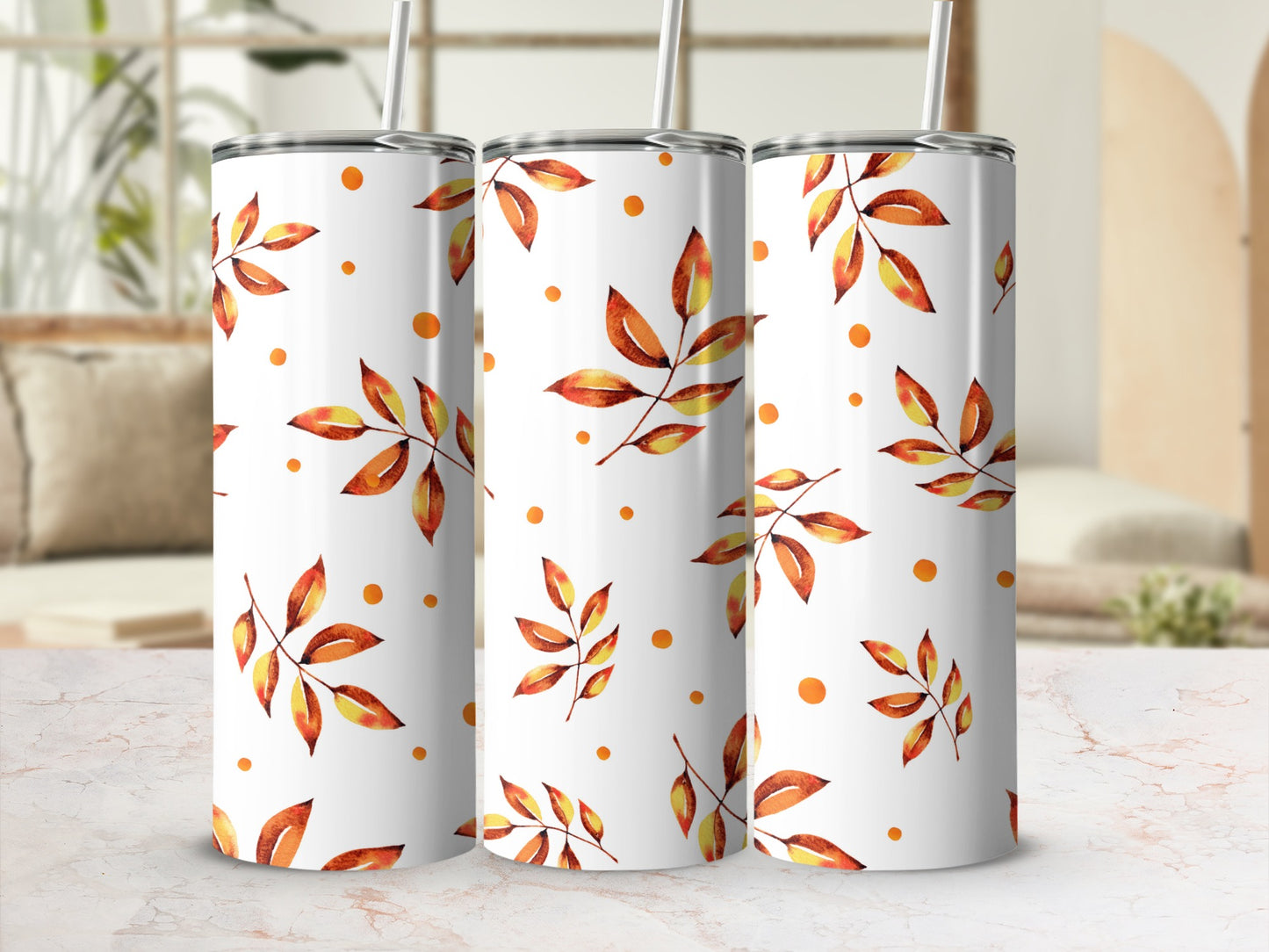 White tumbler with repeating watercolor autumn leaves and dots pattern.