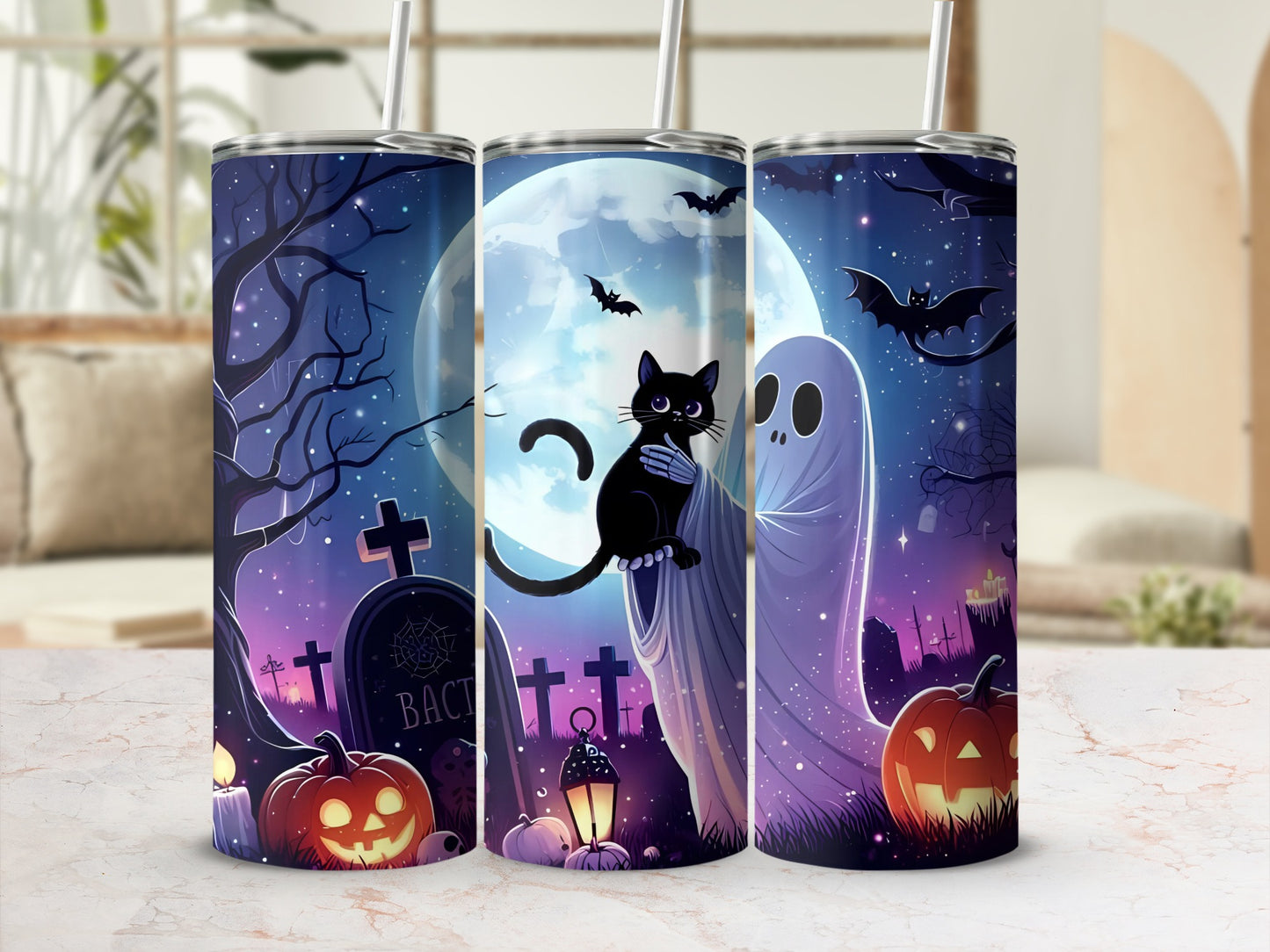 Halloween tumblers with a graveyard scene, black cat, ghost, pumpkins, and bats.