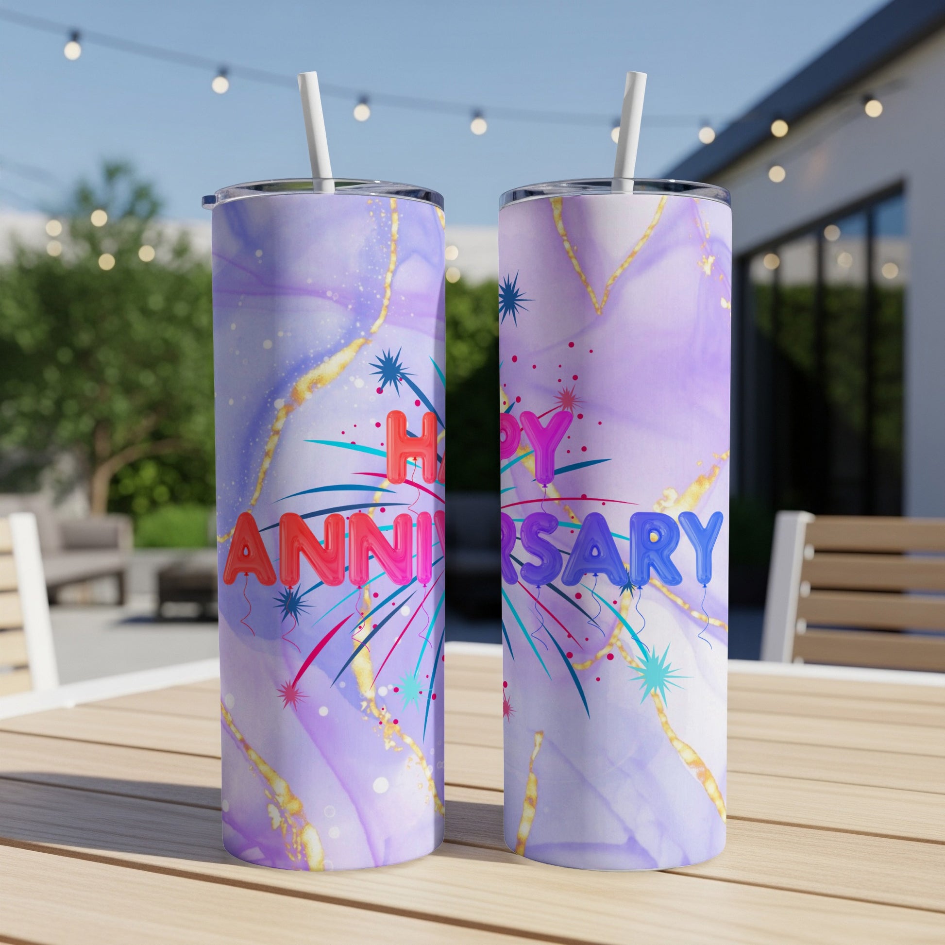 Happy Anniversary tumbler with colorful fireworks and marble background.