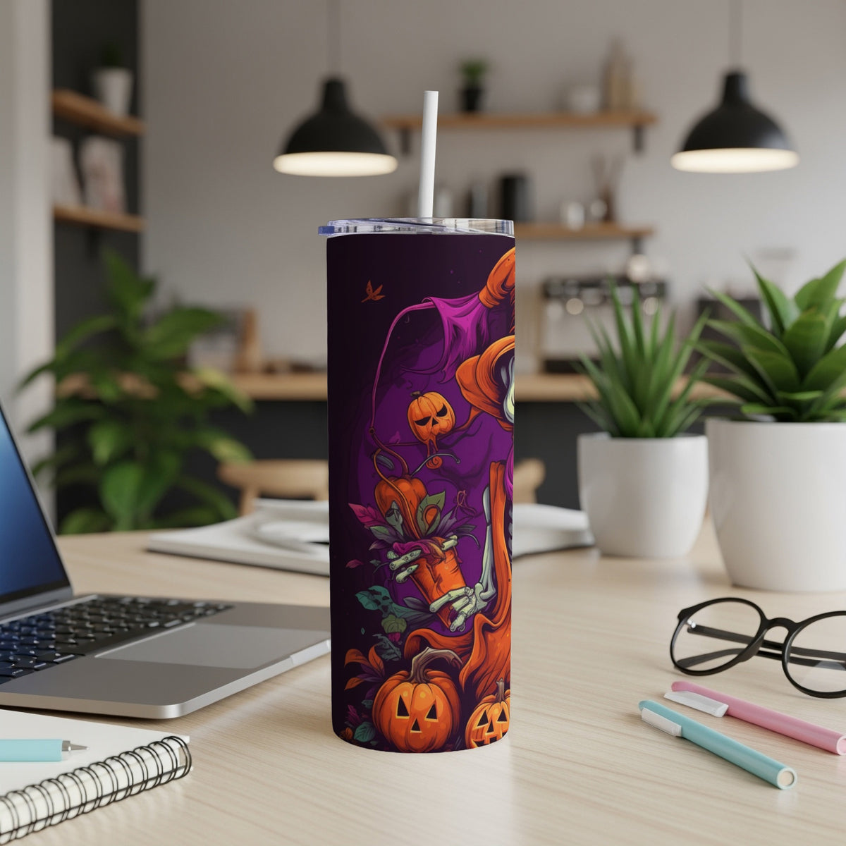 Tall tumbler with Halloween skeleton and pumpkin design.