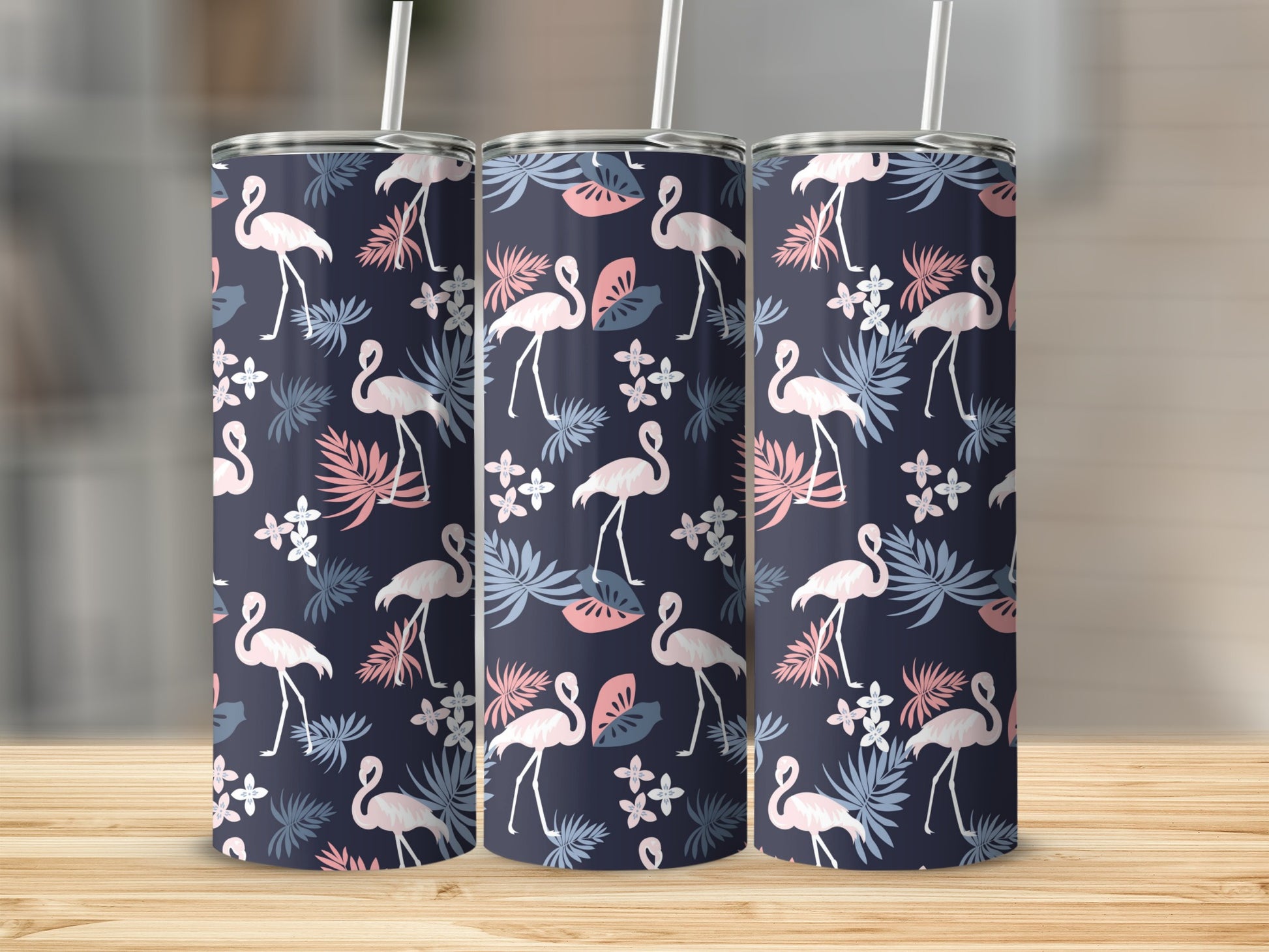 Three tumblers with a navy blue background featuring flamingos and tropical leaves.
