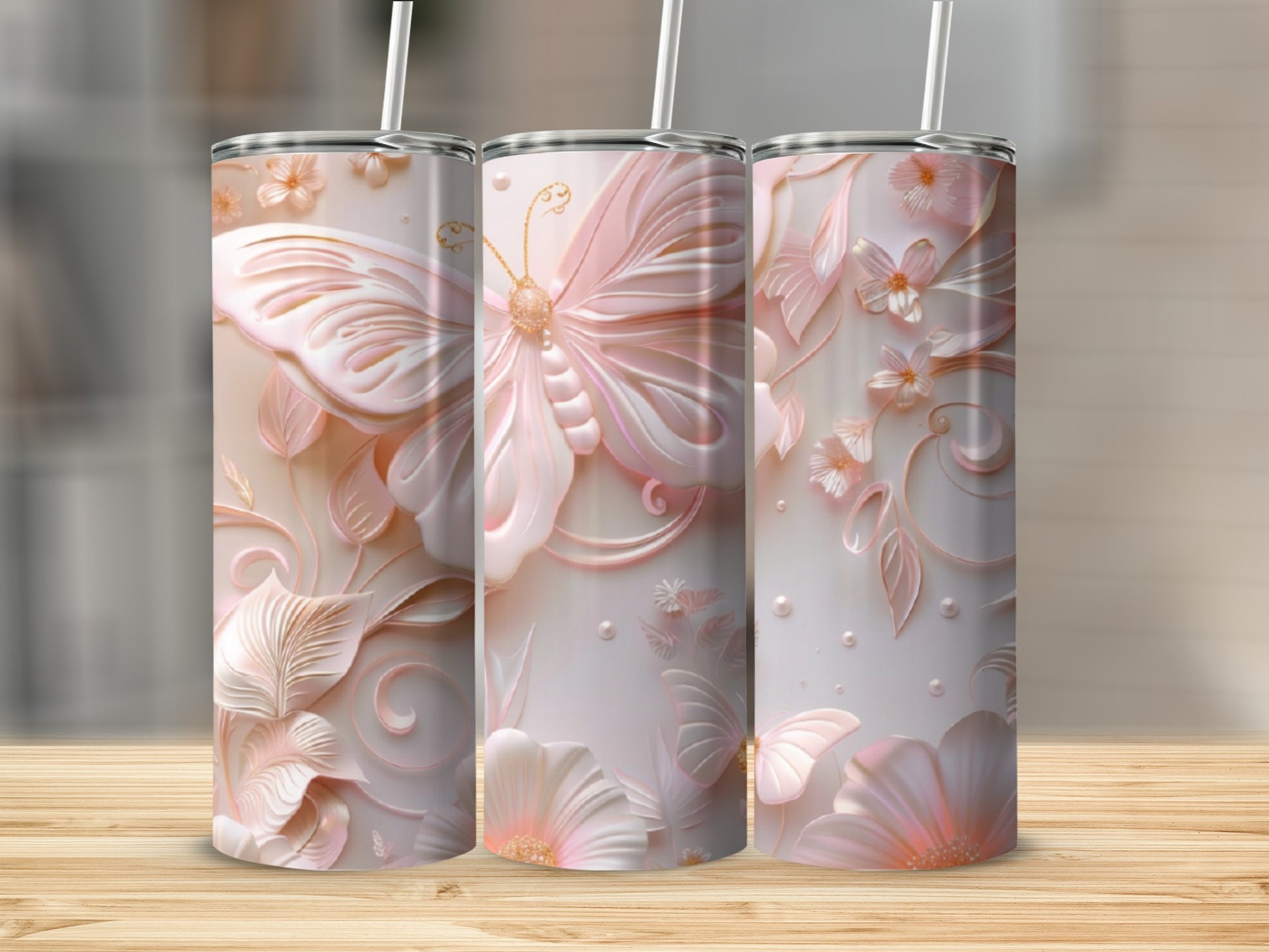 Pink butterfly and floral embossed tumbler with straw, 3 views.