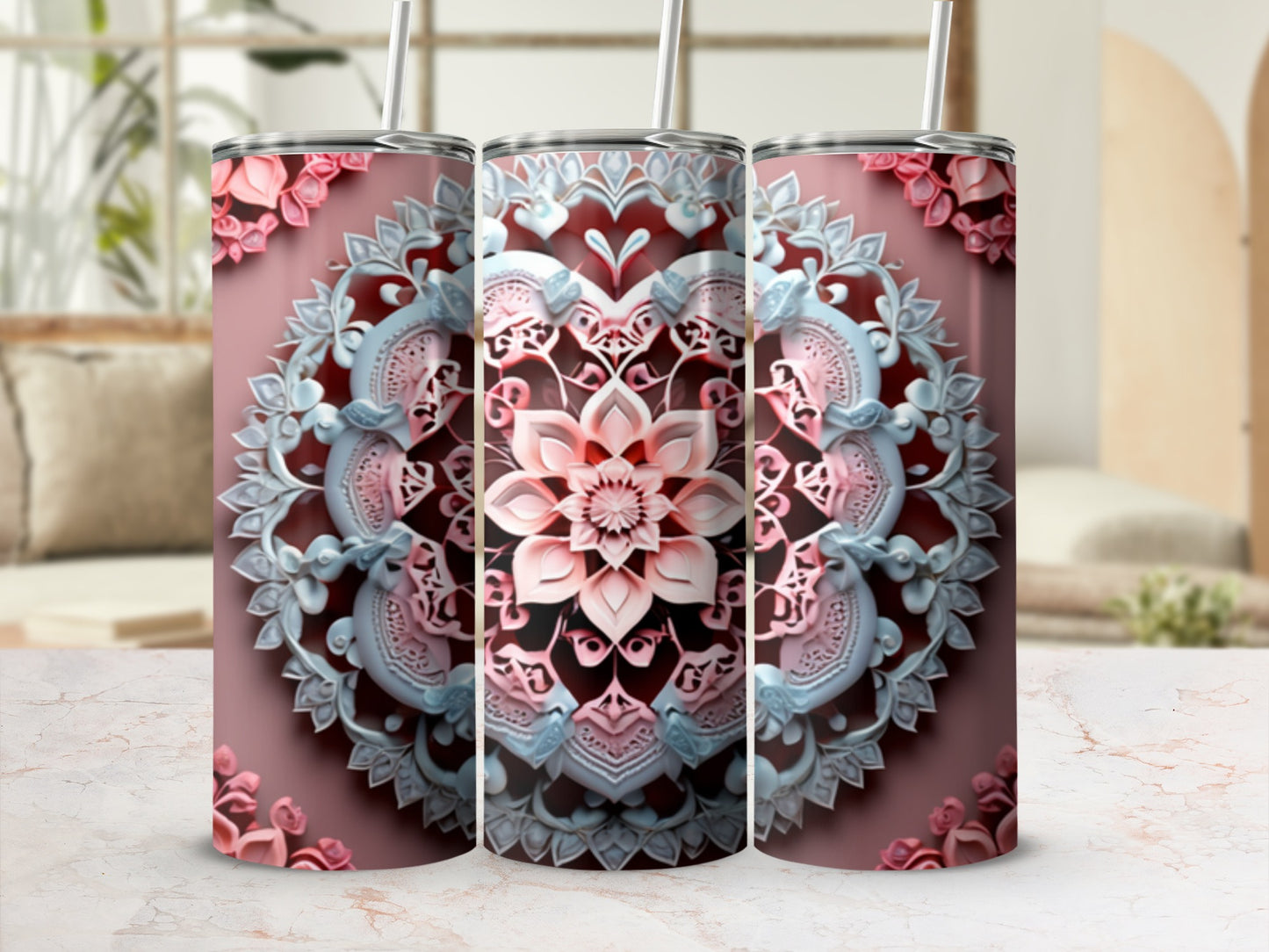 Pink and blue mandala design on a tumbler with a straw.