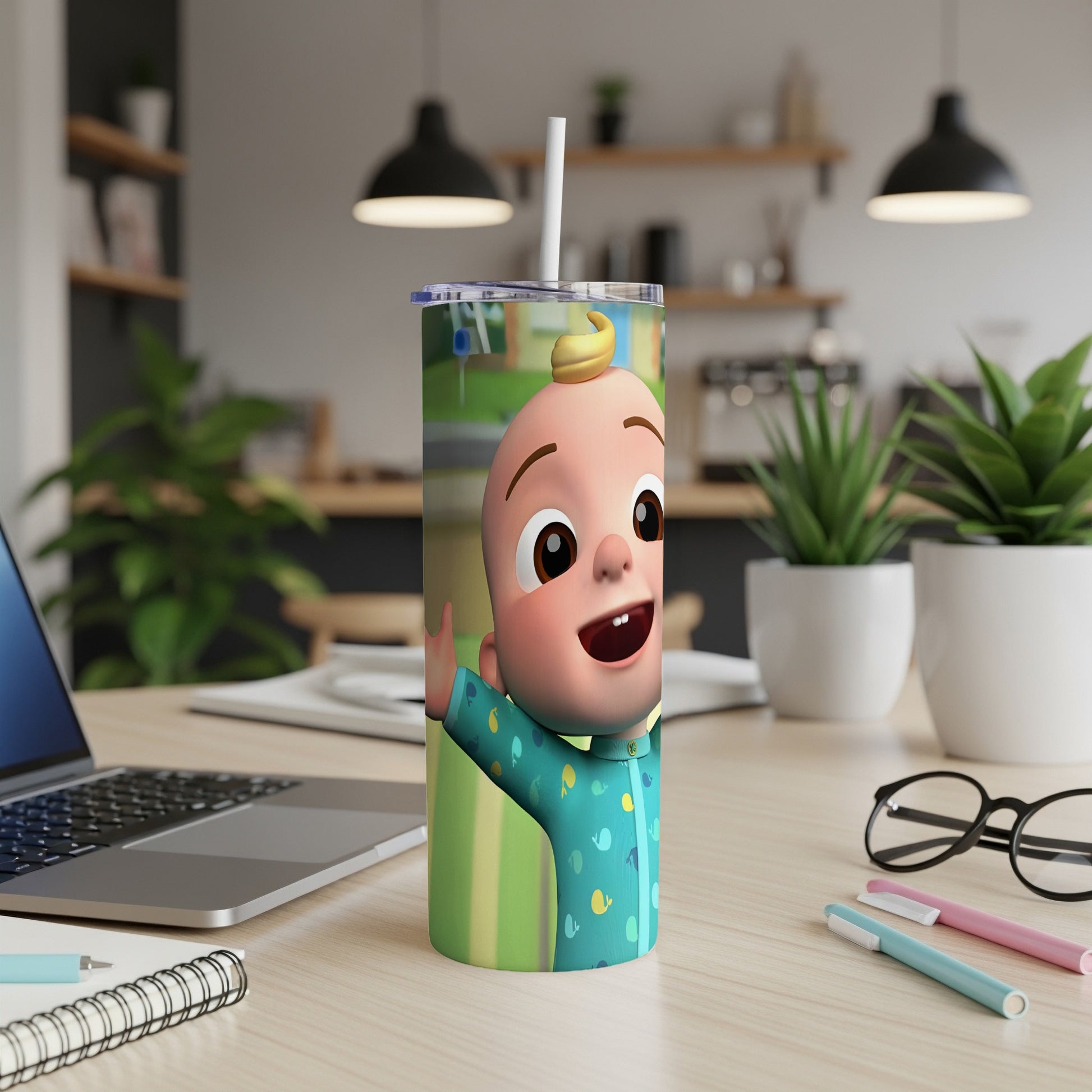 JJ from Cocomelon waving on a blue patterned tumbler with straw.