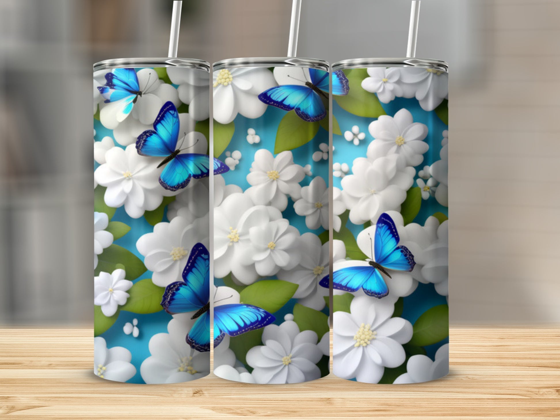 Blue butterflies and white flowers adorn a blue background on a tumbler.