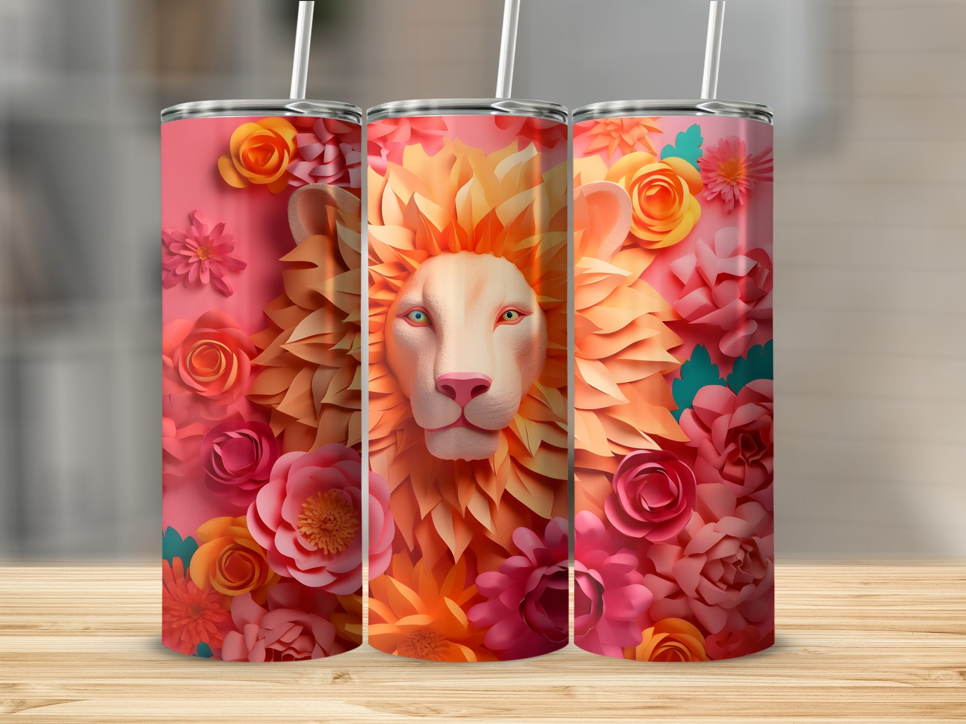 Three tumblers featuring a lion's face surrounded by colorful flowers.