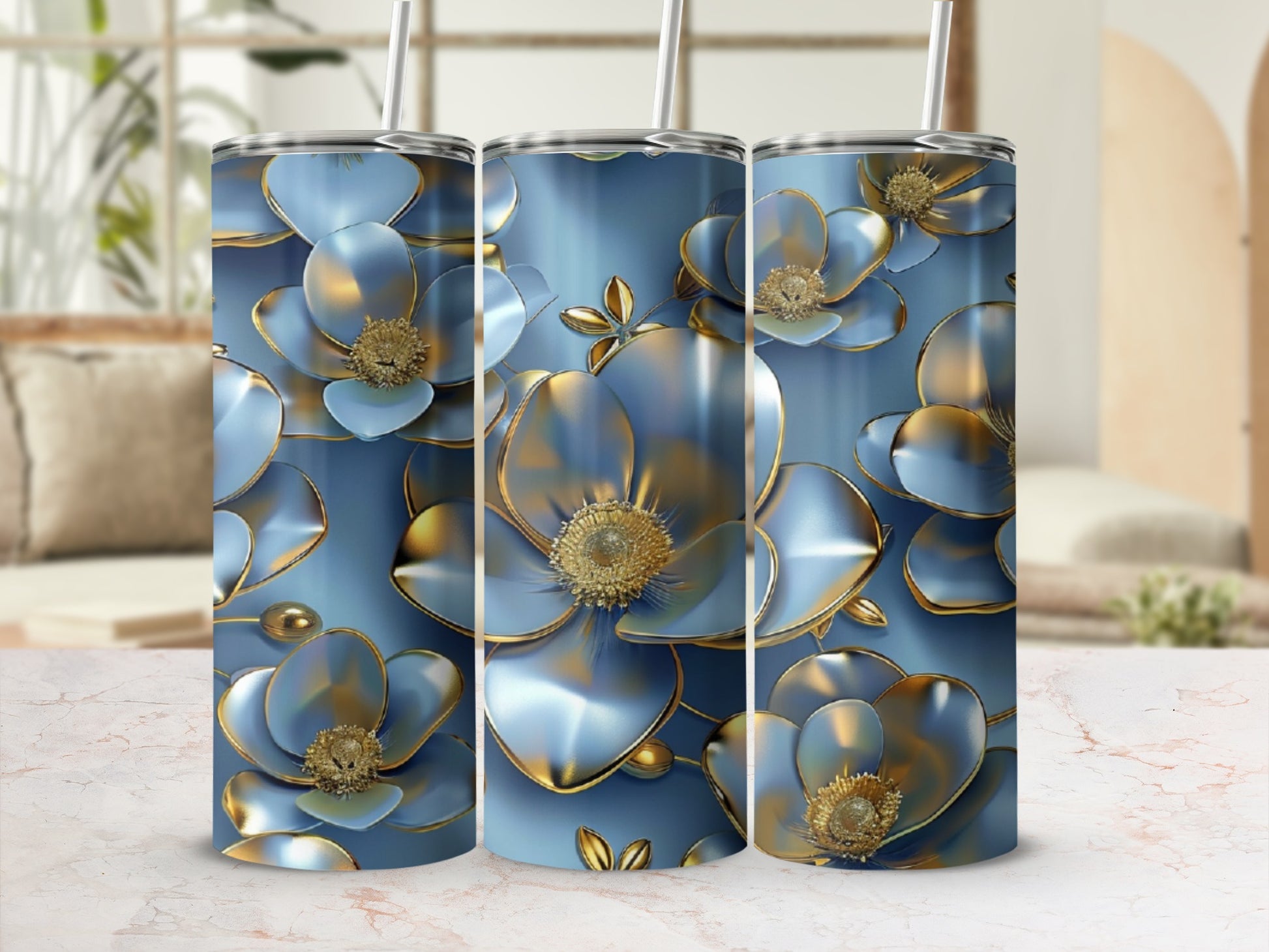 Three tall tumblers with metallic blue floral design and gold accents.