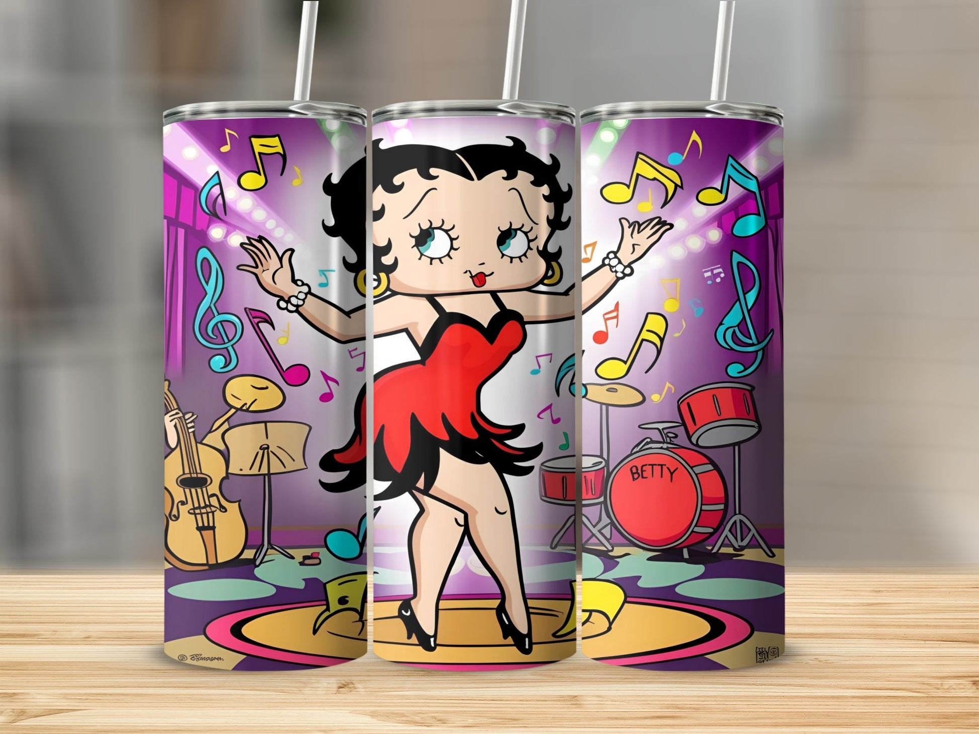 Betty Boop cartoon character dancing on a stage with musical notes and instruments.