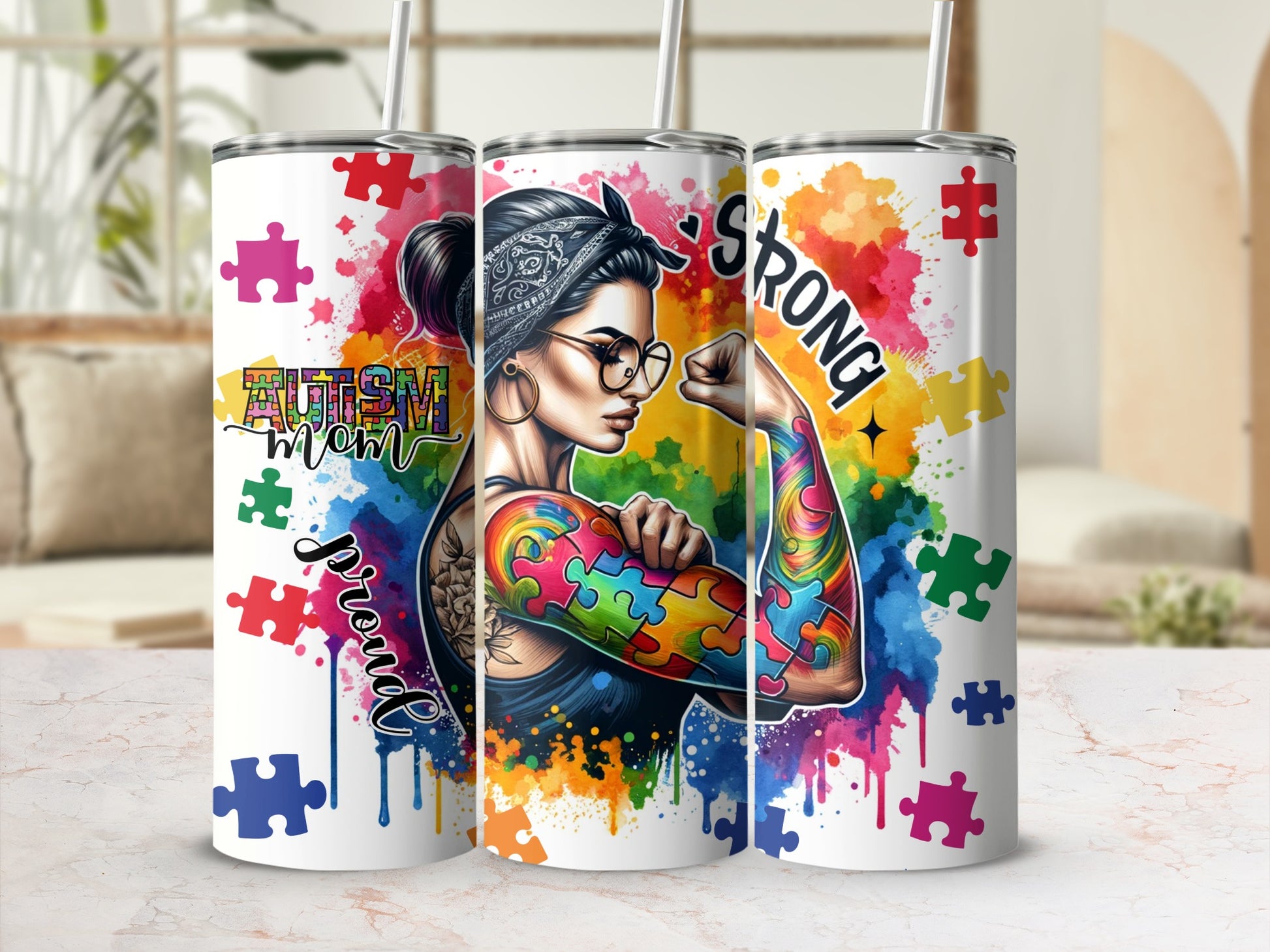 Tumbler with colorful puzzle piece arm art and "Autism Mom" text.