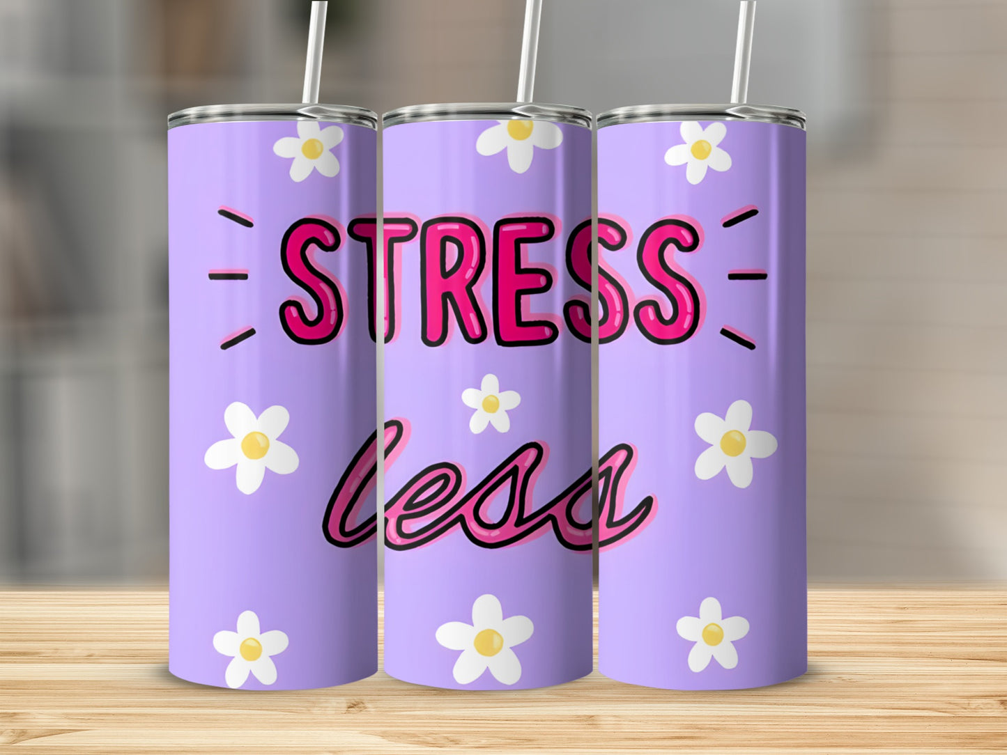 Purple tumbler with "Stress Less" text and white daisies.
