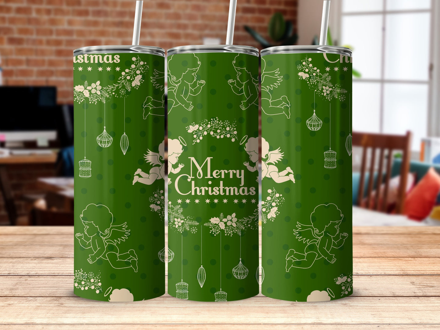 Green tumbler with "Merry Christmas" and angels, snowflakes, and ornaments design.