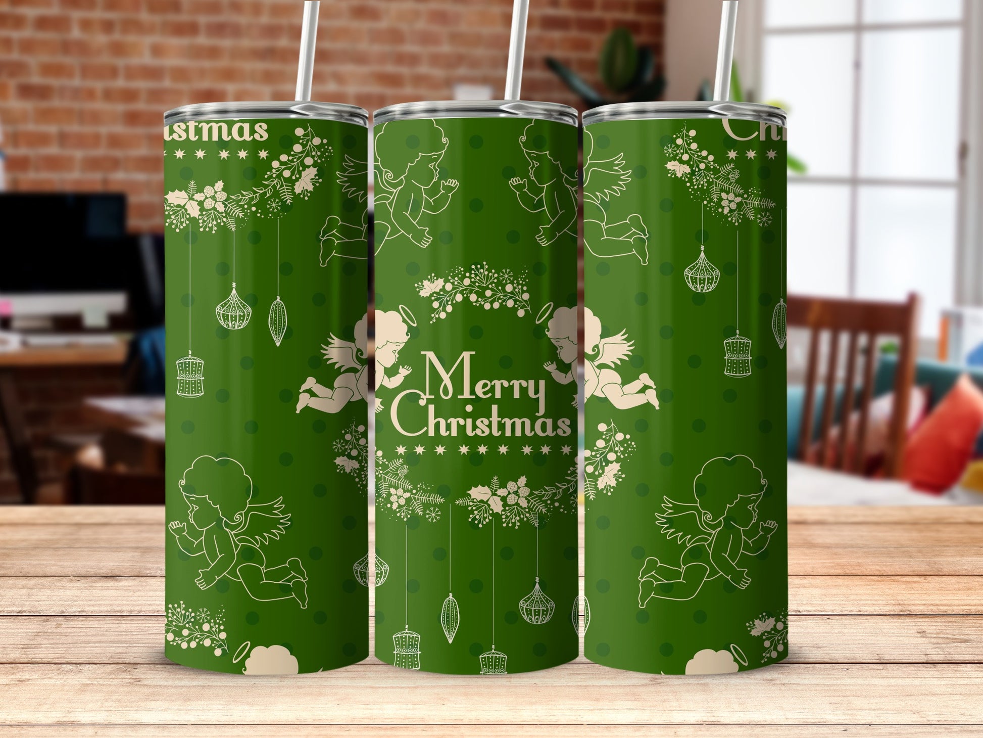 Green tumbler with "Merry Christmas" and angels, snowflakes, and ornaments design.