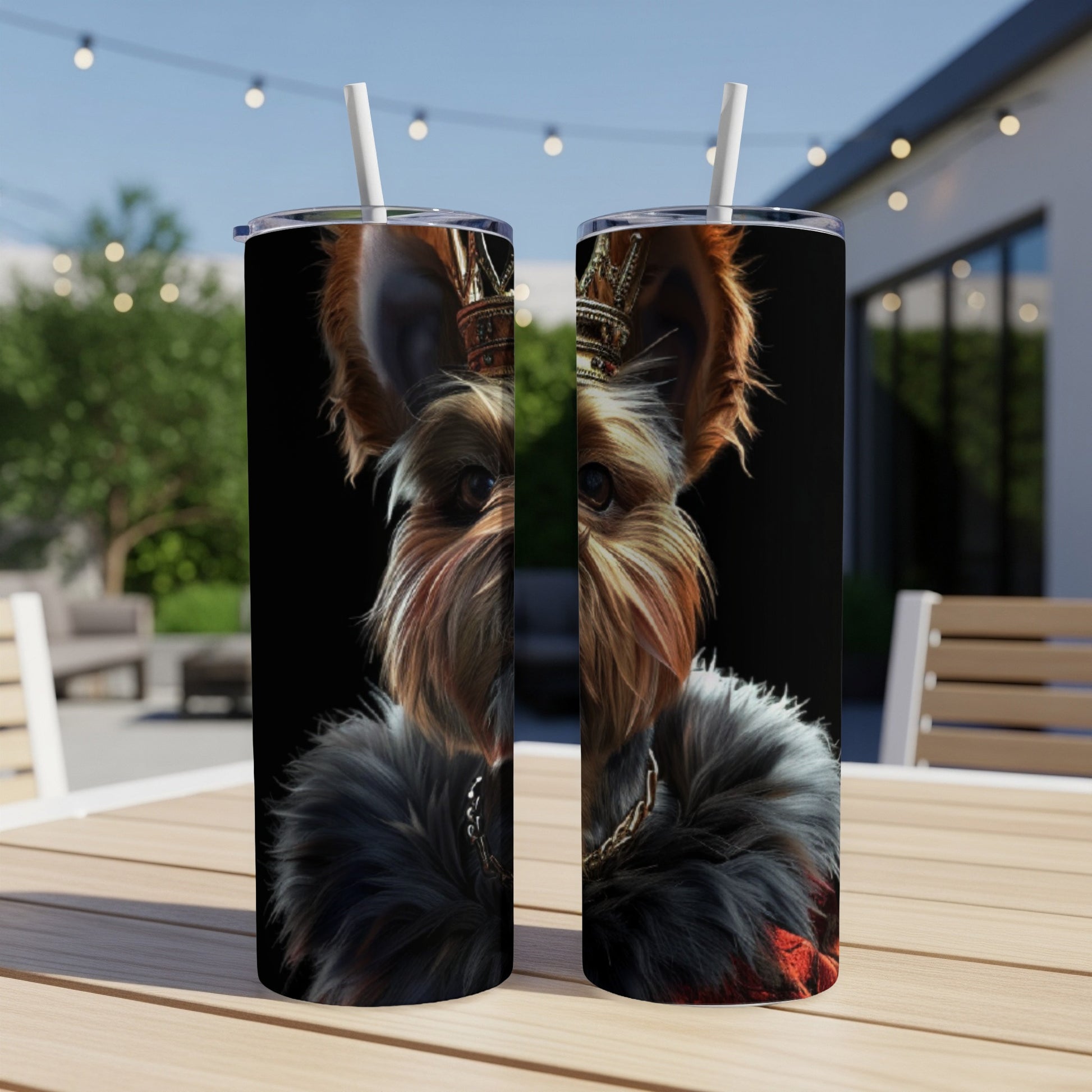 Yorkshire terrier wearing a crown and fur collar, presented on a tumbler.