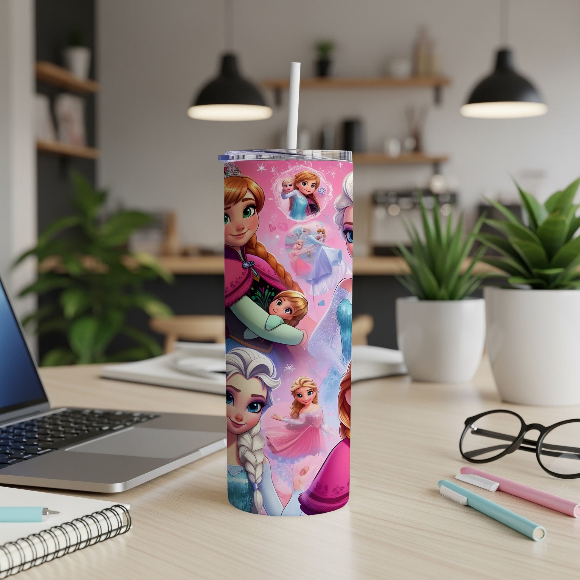 Pink tumbler with Elsa, Anna, and Olaf from Frozen.