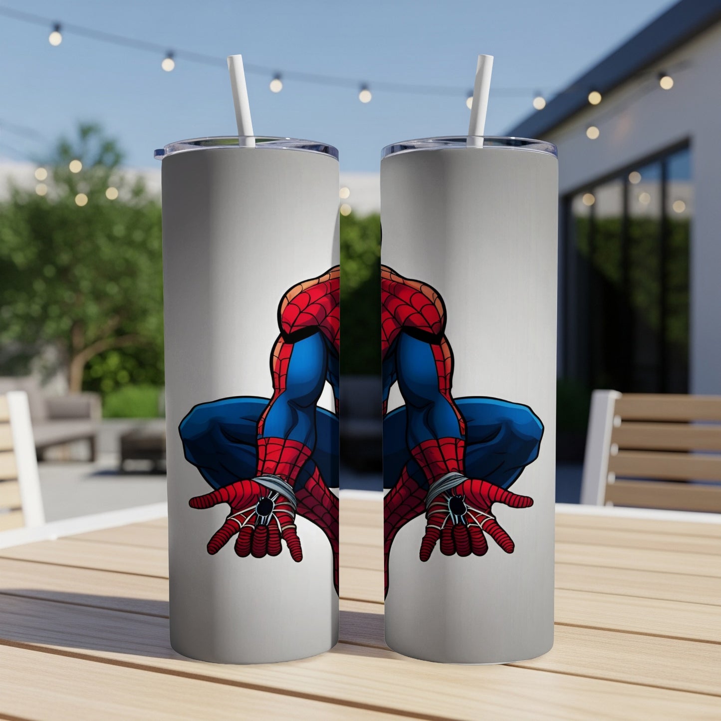Two tall tumblers with Spider-Man artwork, displayed outdoors.