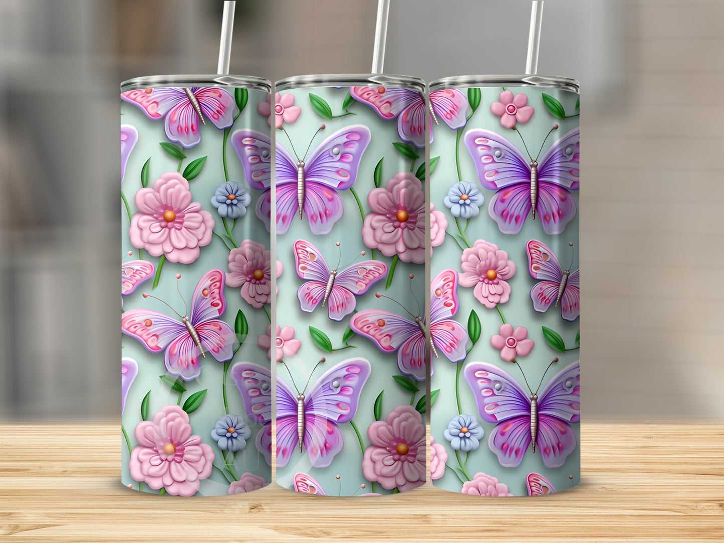 Pink and purple butterflies and flowers on a light green tumbler.
