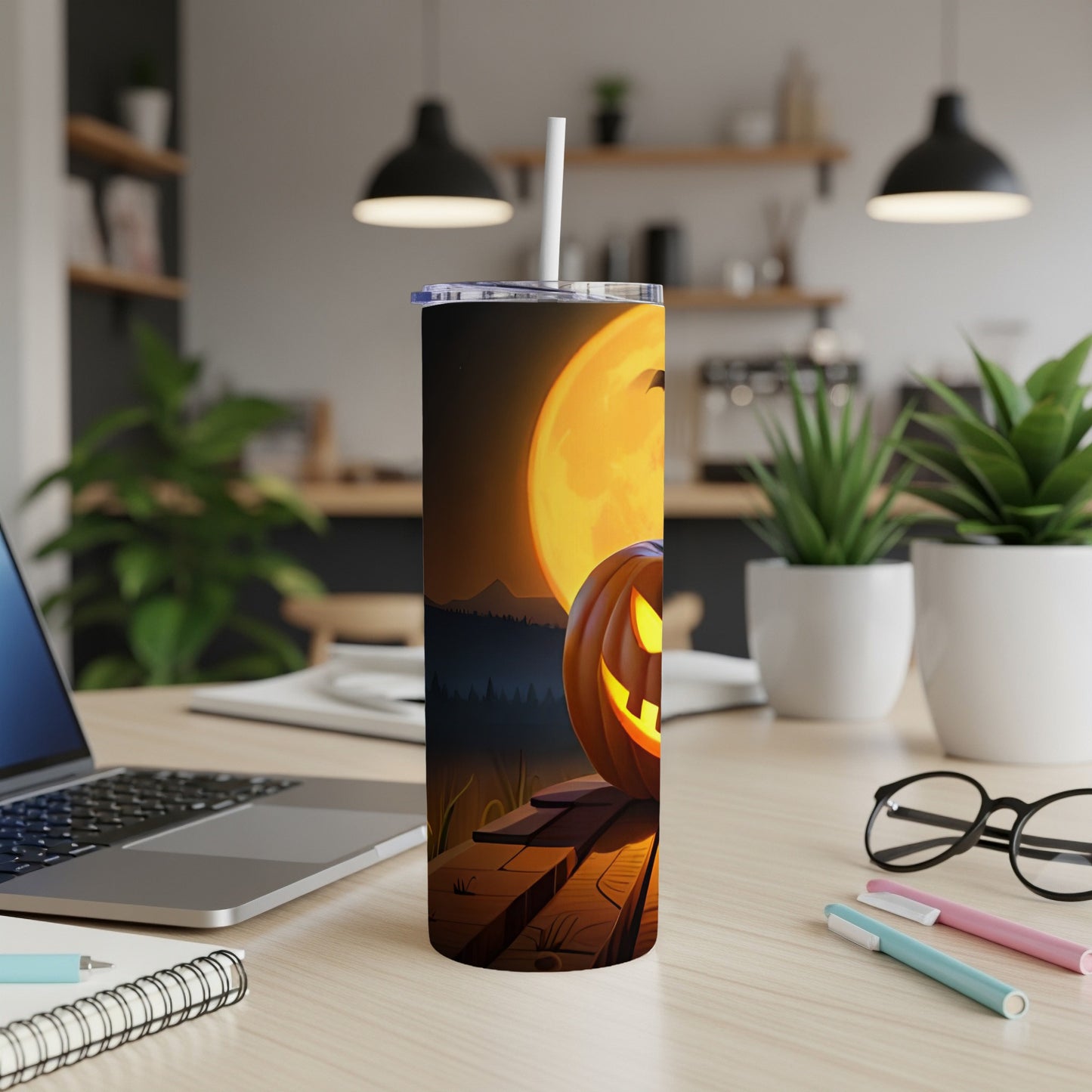 Tumbler with jack-o'-lantern and full moon Halloween design.