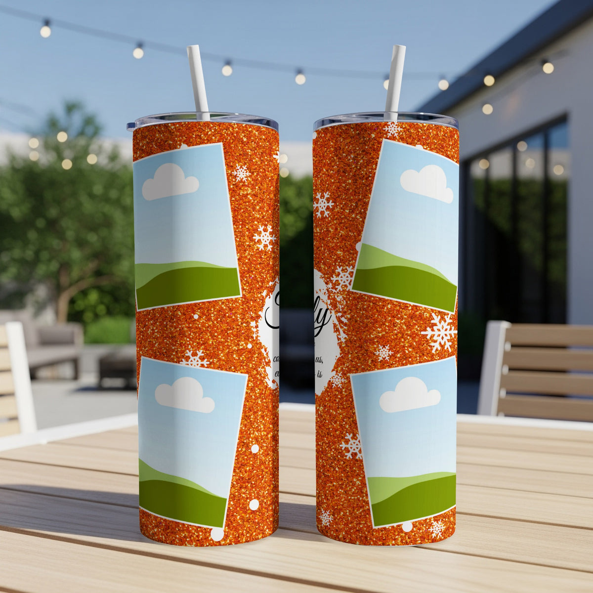 Two orange glitter tumblers with clouds and landscapes, a handwritten word.