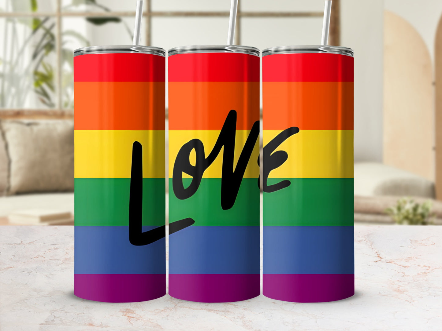 Rainbow striped tumbler with "love" in black script.