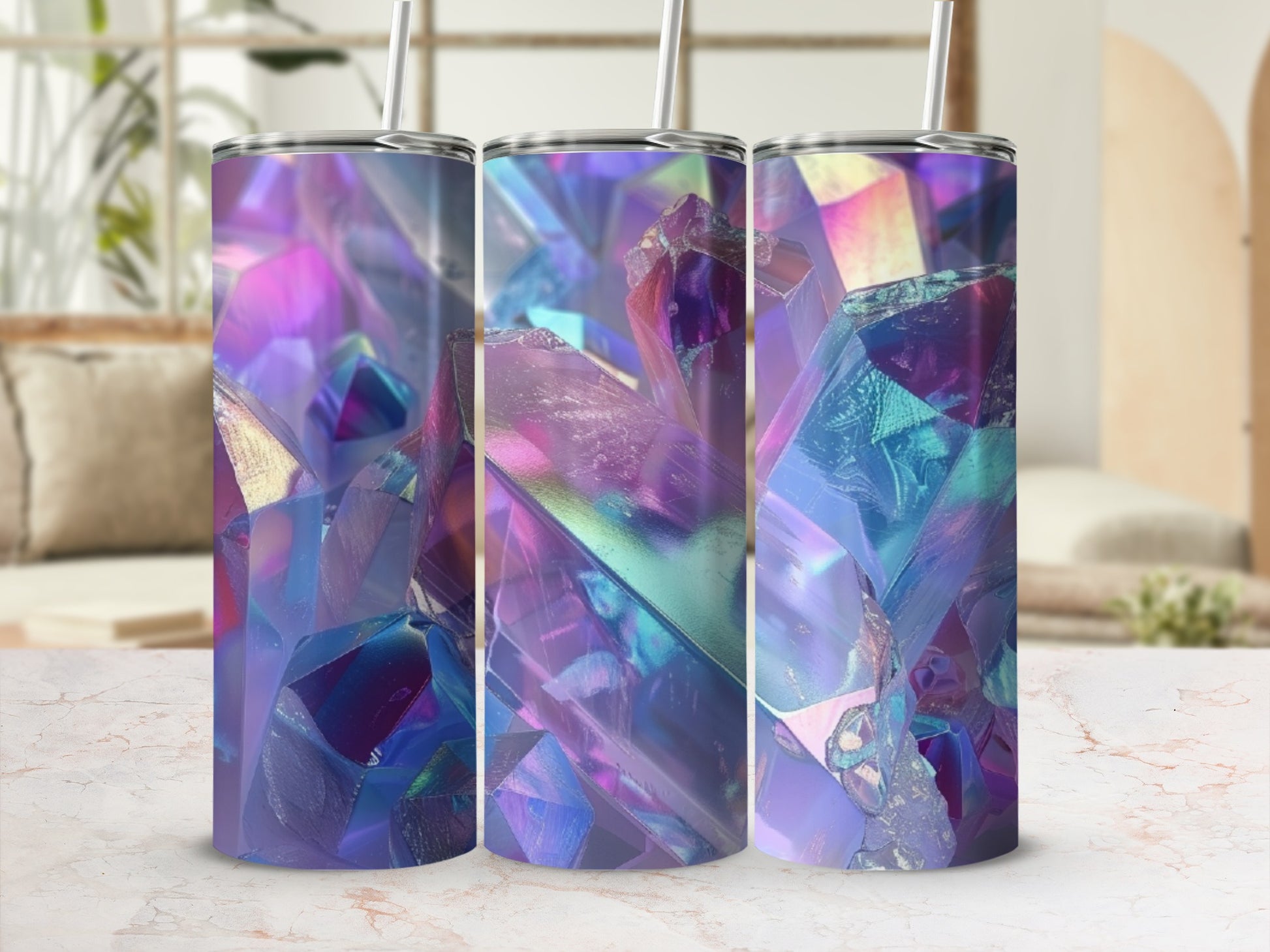 Tumbler with iridescent crystal pattern and straw, on a marble surface.