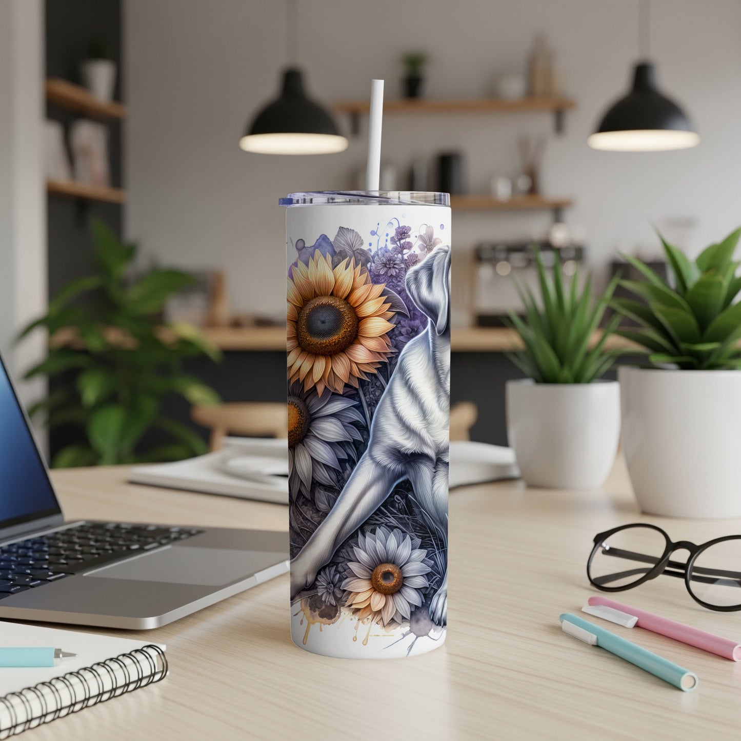 White and brown dog with sunflowers on a skinny tumbler.