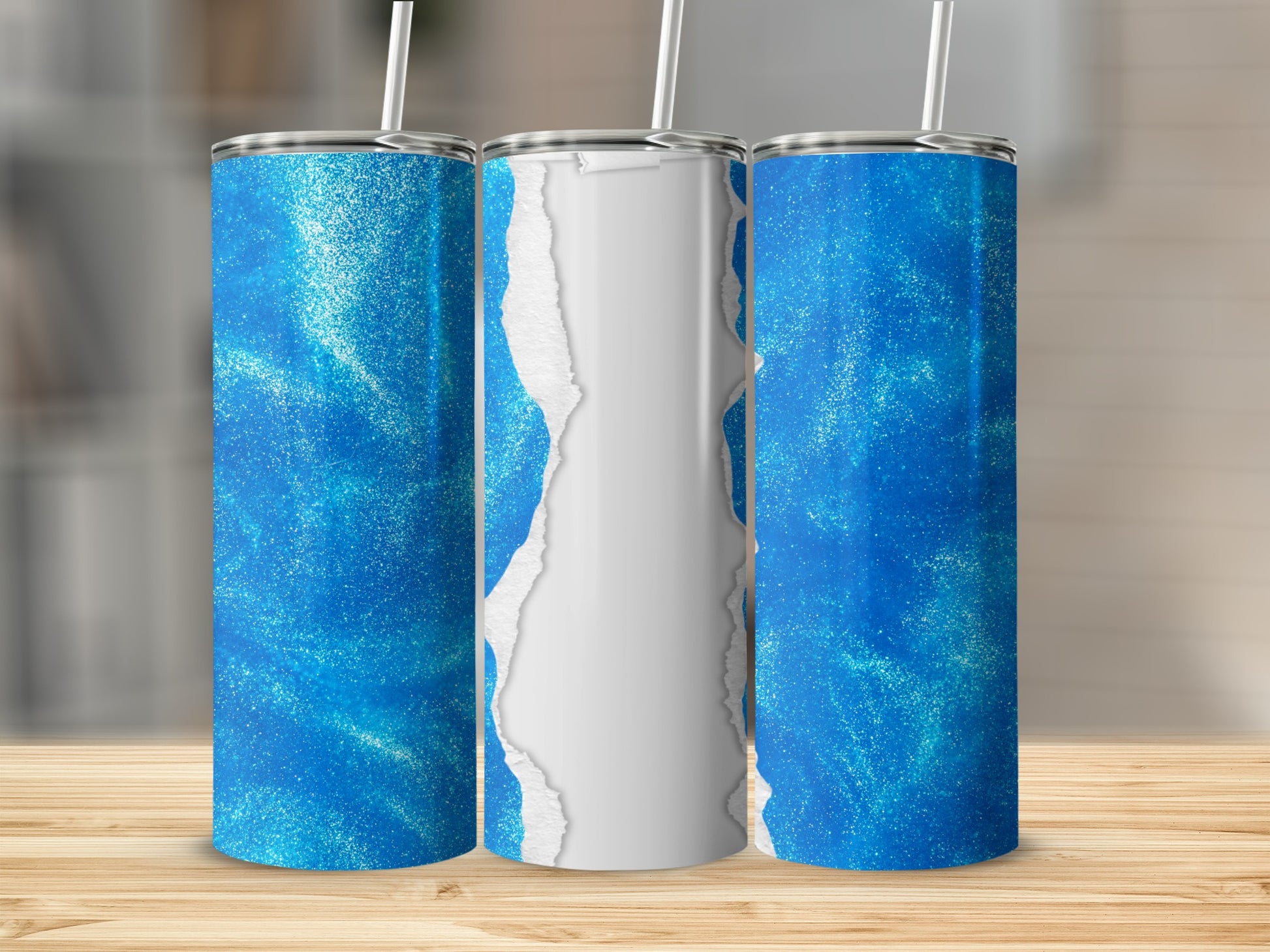 Blue glitter tumbler with torn paper effect.