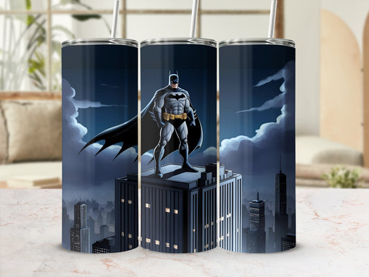 Batman standing heroically on a skyscraper rooftop at night.