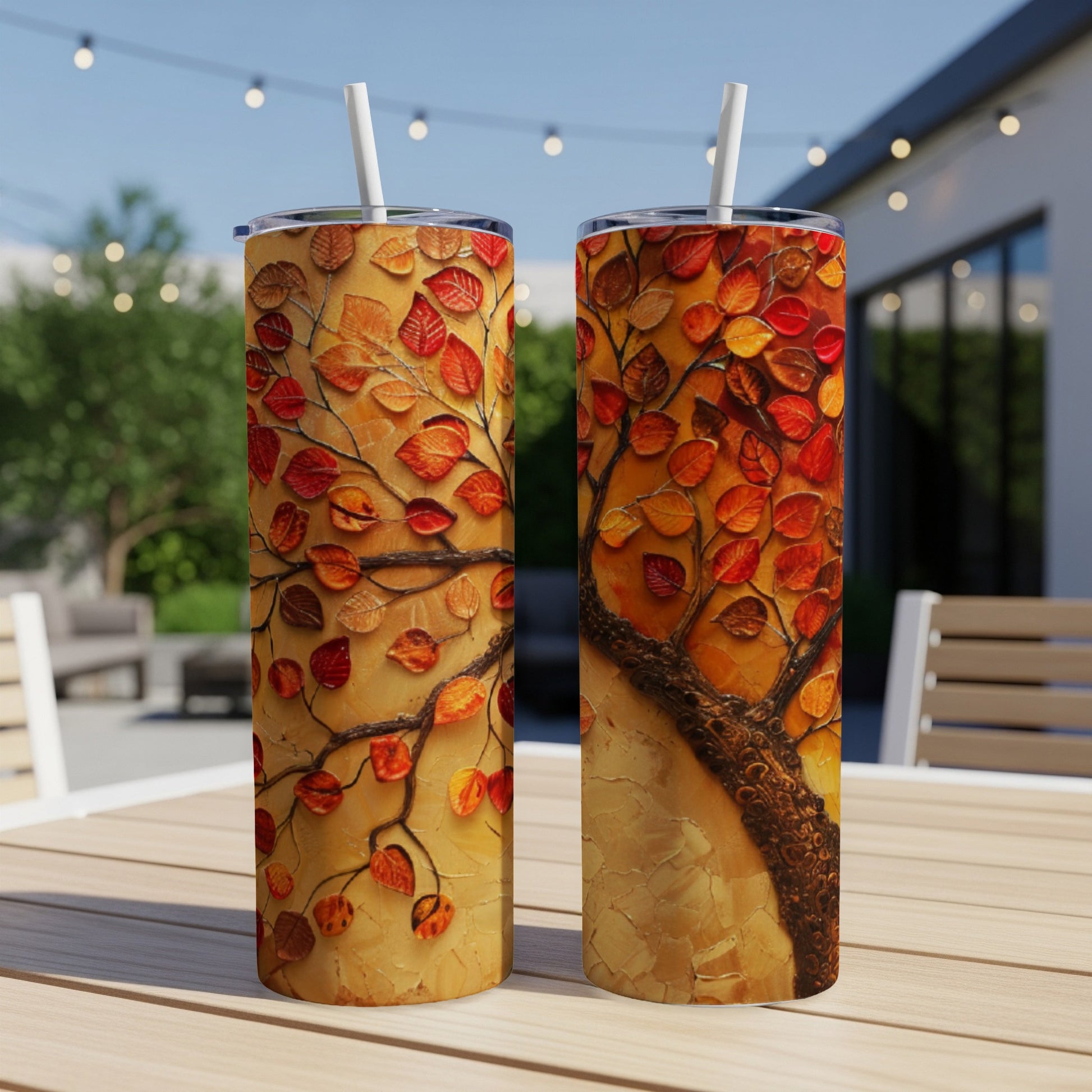 Two tumblers with a textured tree art design in autumnal colors.