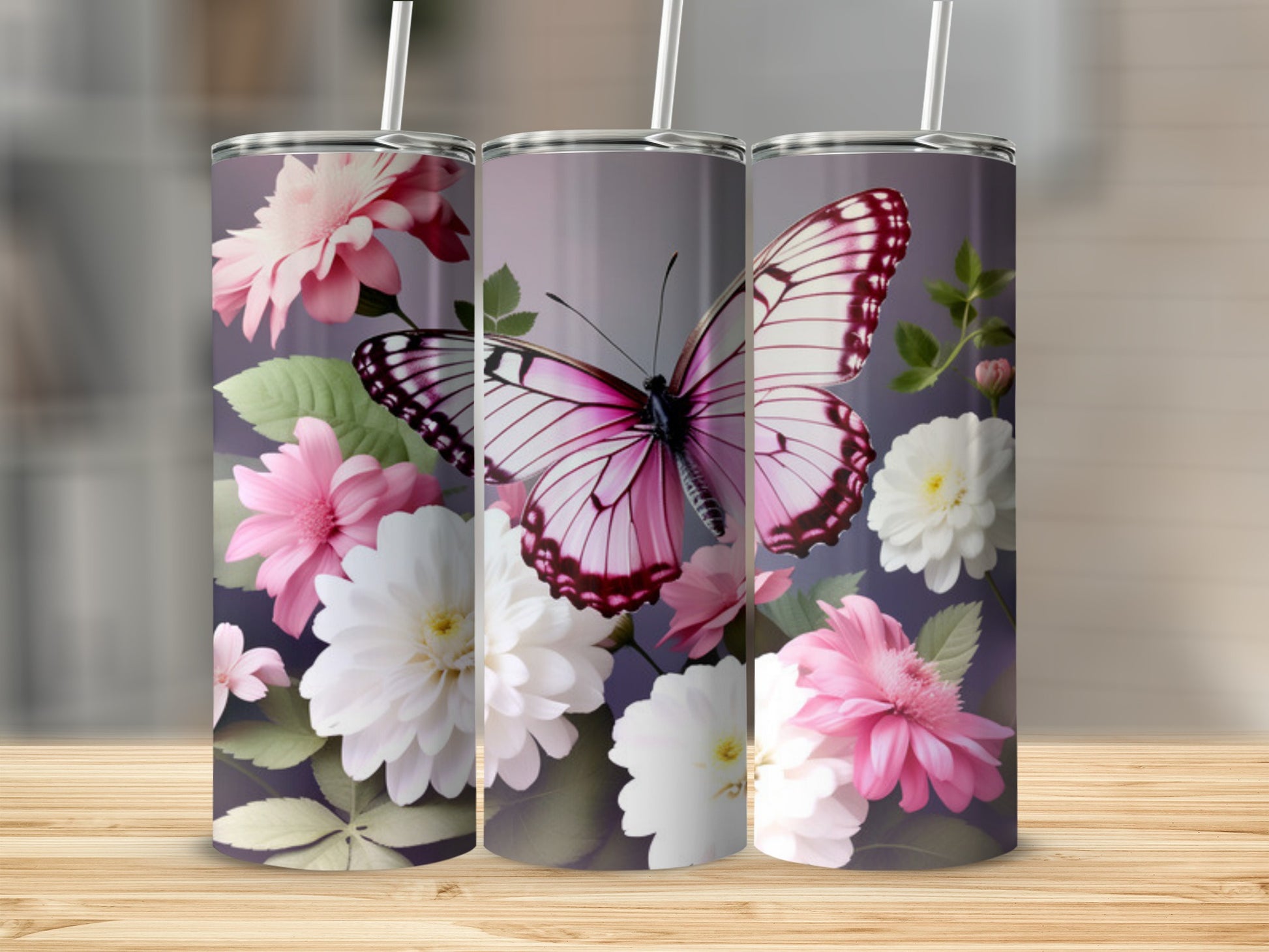 Pink butterfly and floral design on three tumblers.