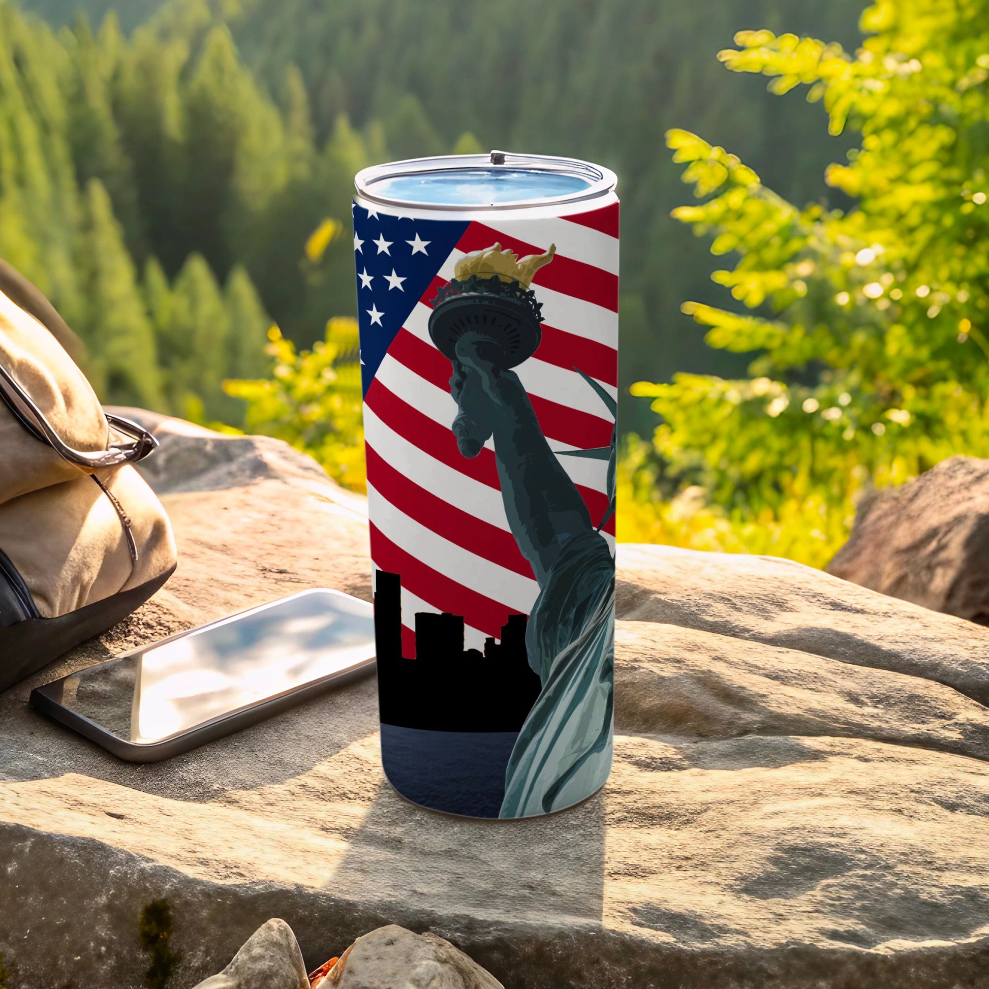 Statue of Liberty and American flag tumbler with black silhouette skyline.