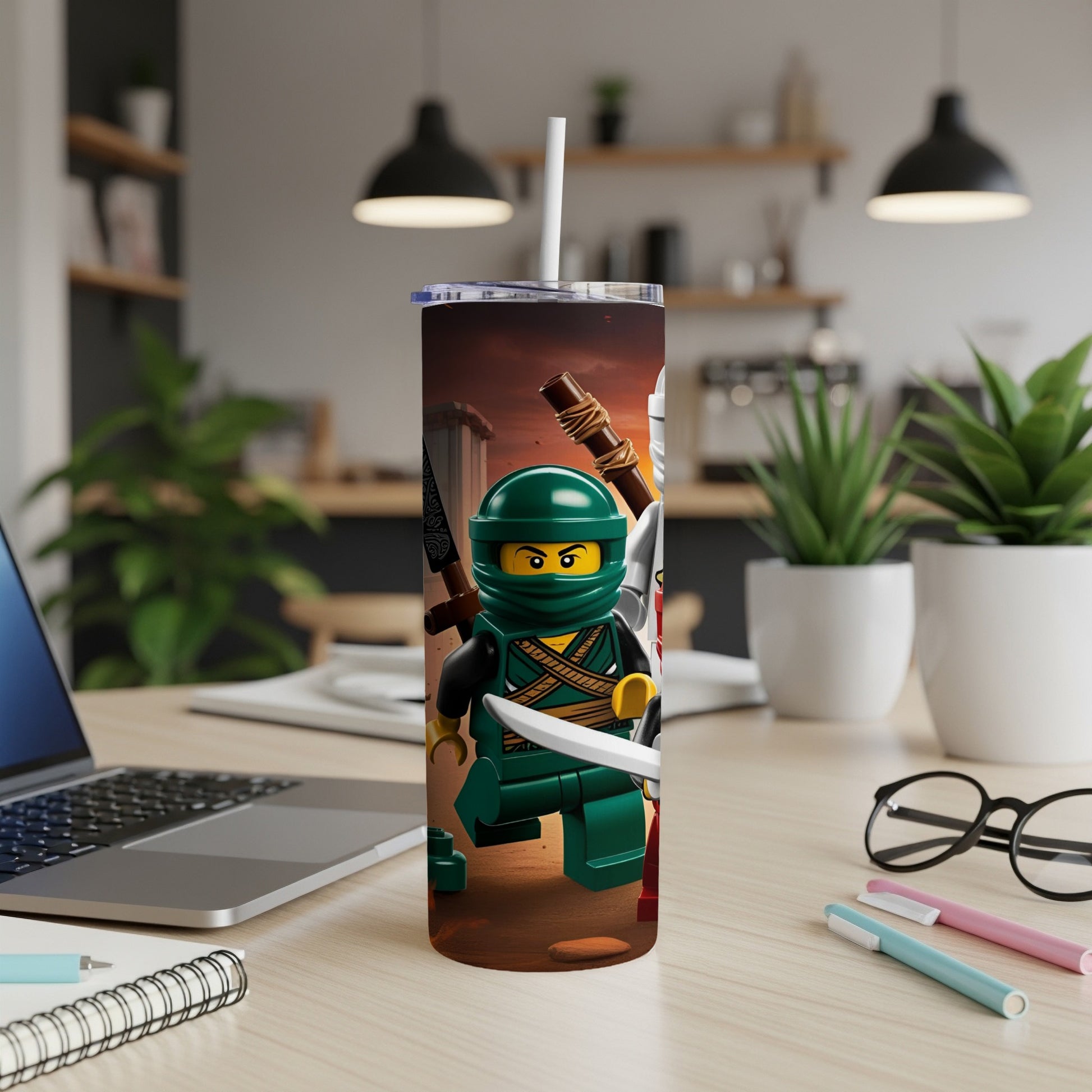 Lego Ninjago characters with weapons on a stainless steel tumbler.