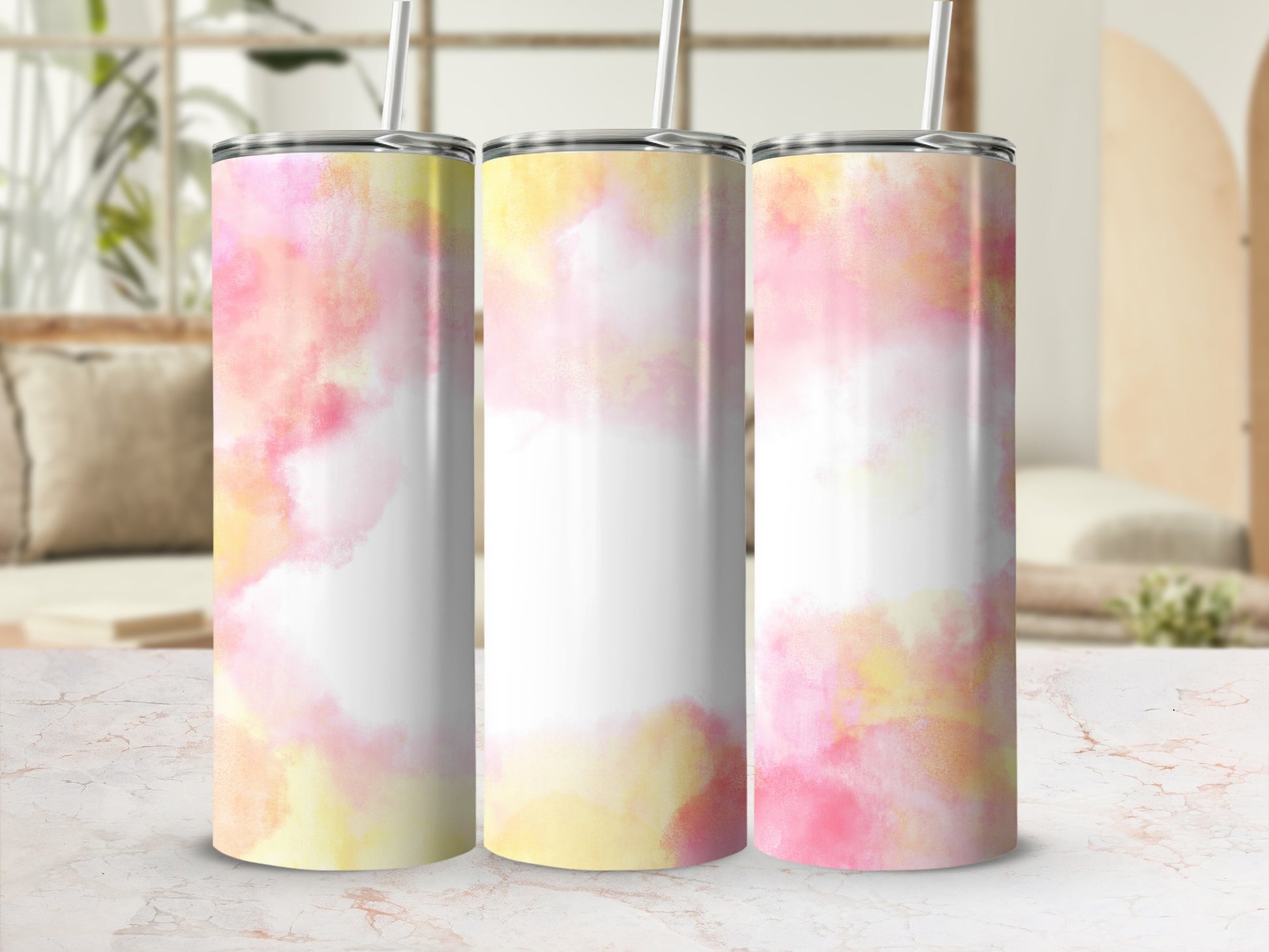 Three tumblers with pink and yellow watercolor splashes and white centers.