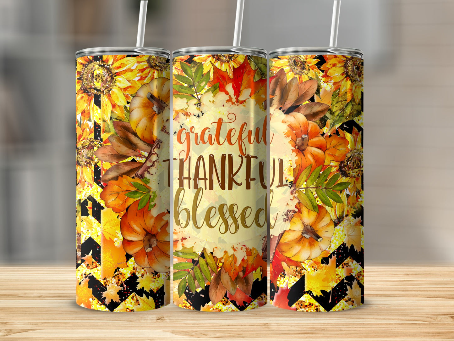 "Grateful Thankful Blessed" tumbler with pumpkins, sunflowers, and autumn leaves.