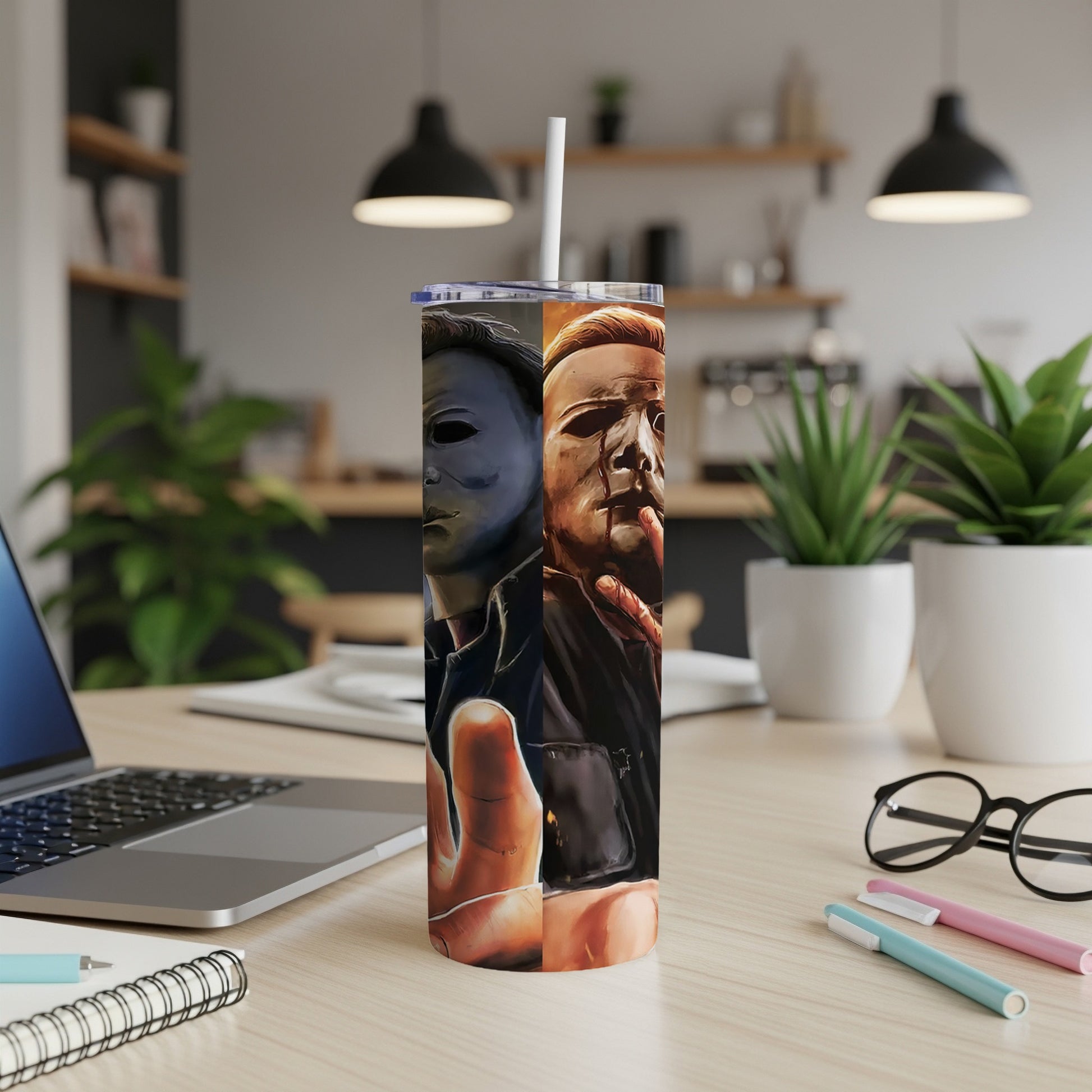 Michael Myers mask and bloody face on a tumbler with a straw.