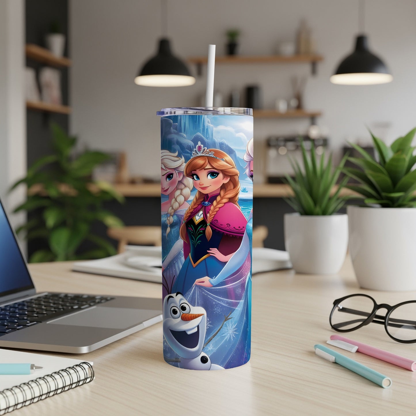 Frozen characters Elsa, Anna, and Olaf on a blue and white insulated tumbler.