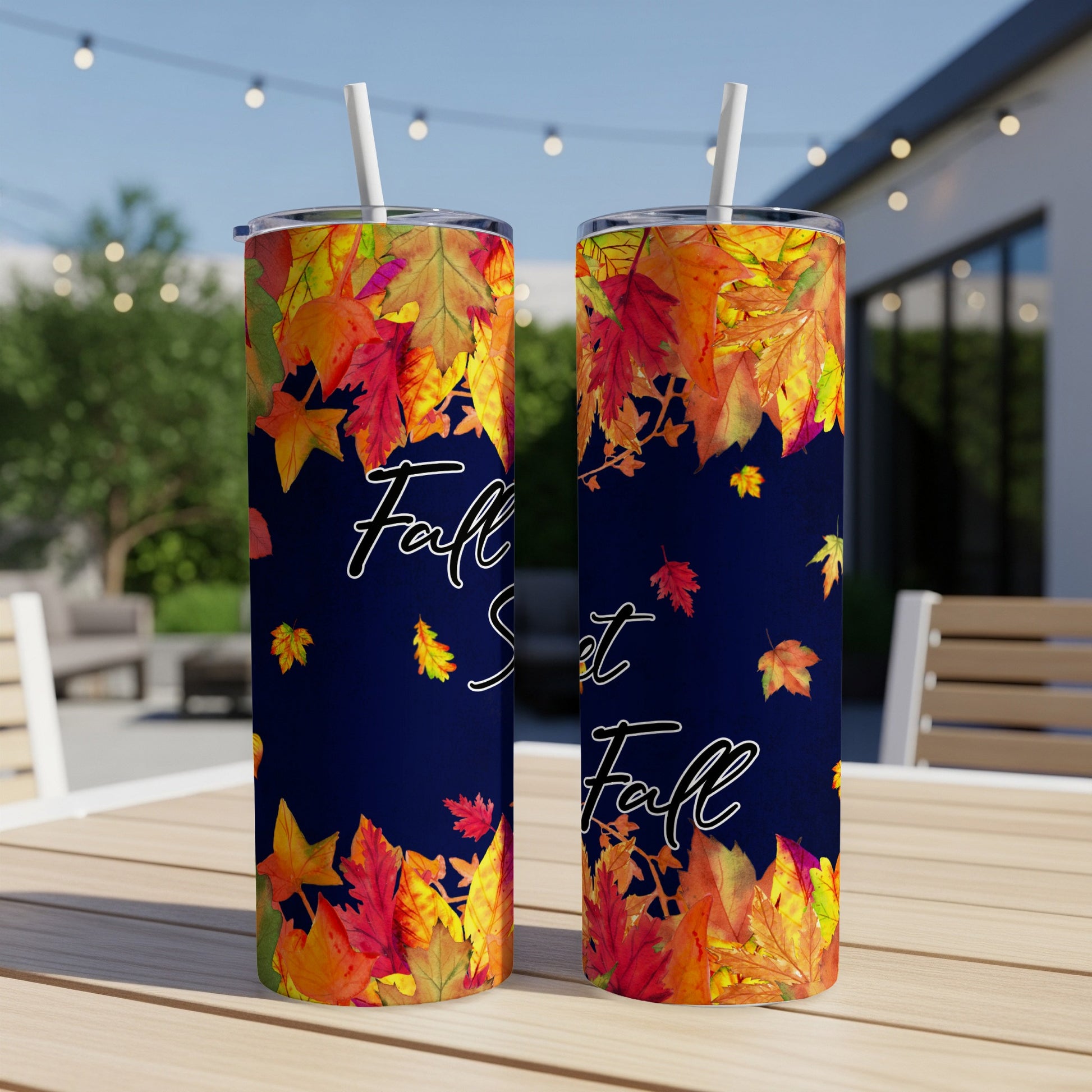 Two navy blue tumblers with fall leaves and "Fall is my favorite Fall" text.