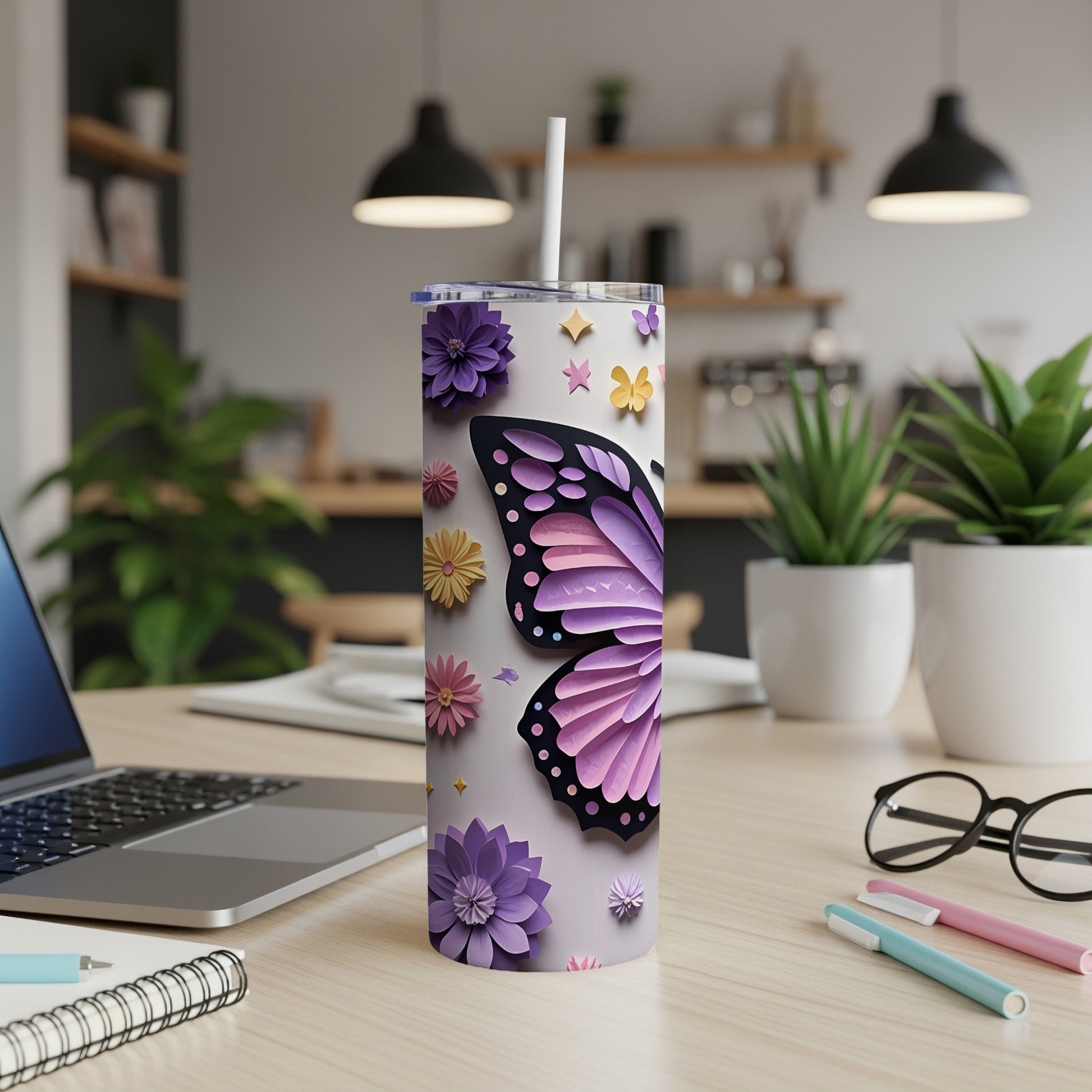 Tumbler with purple butterfly and floral design, featuring a straw.