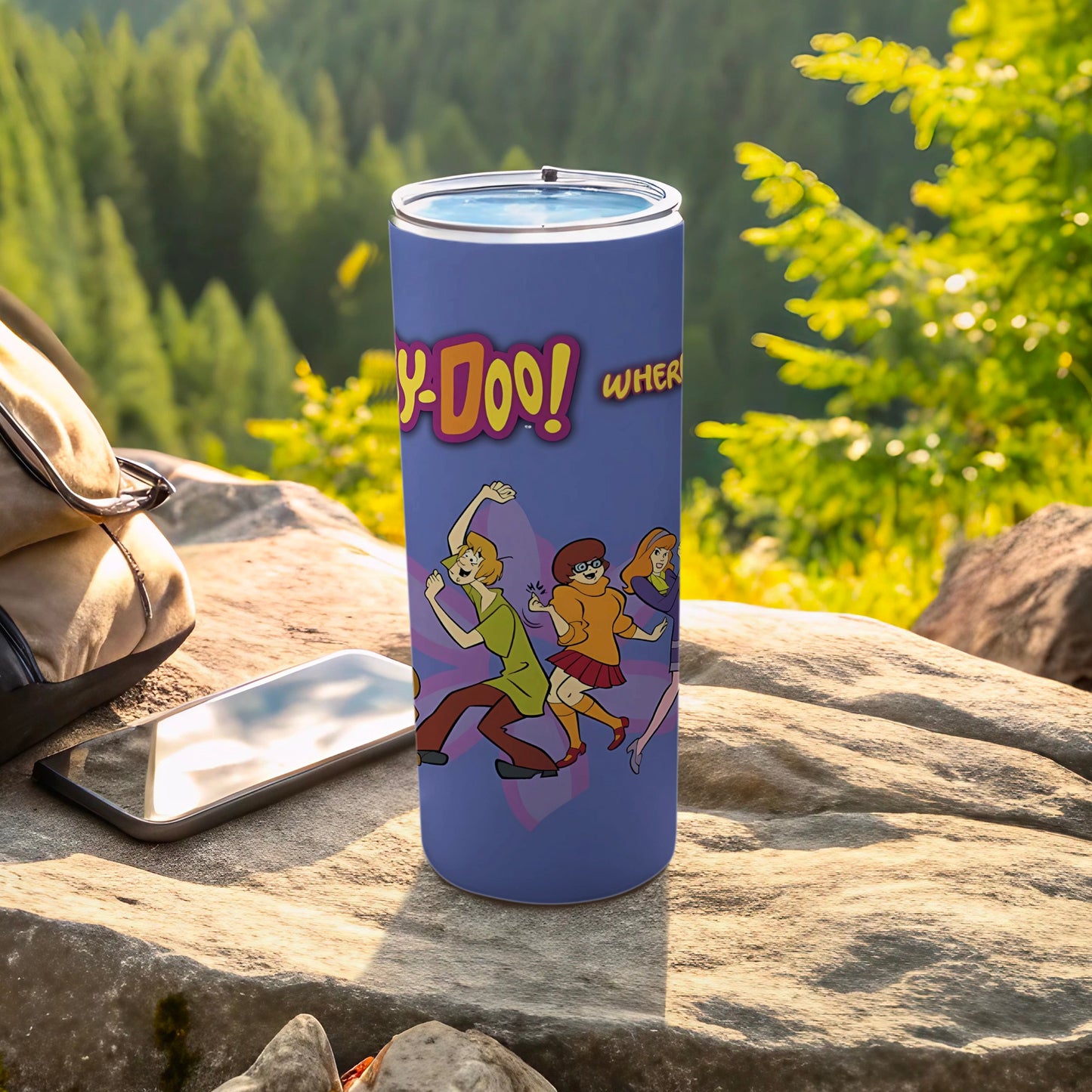 Scooby-Doo! Where! text on a purple tumbler with characters in a forest setting.