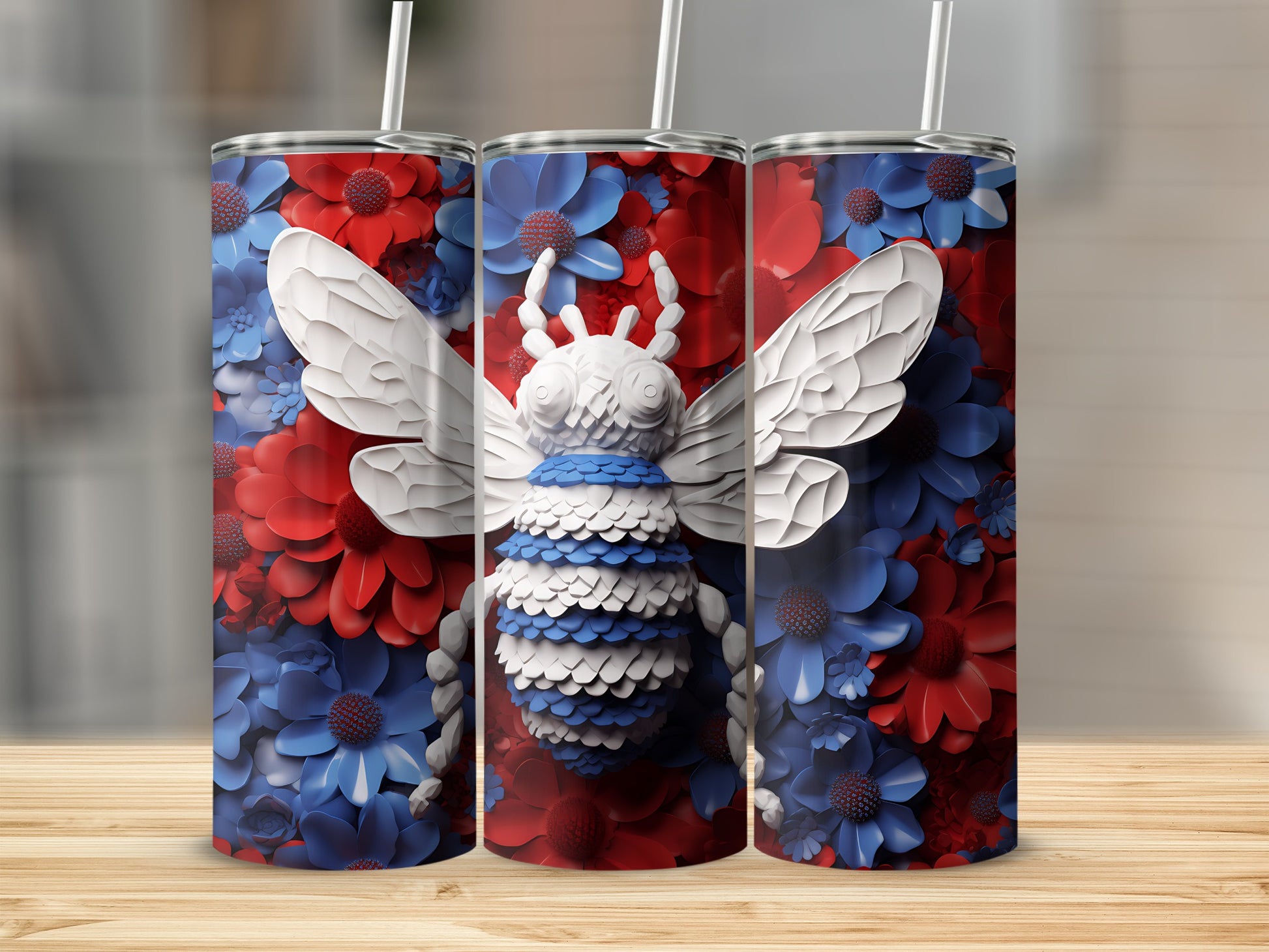 Three tumblers decorated with a white bee and red and blue floral patterns.