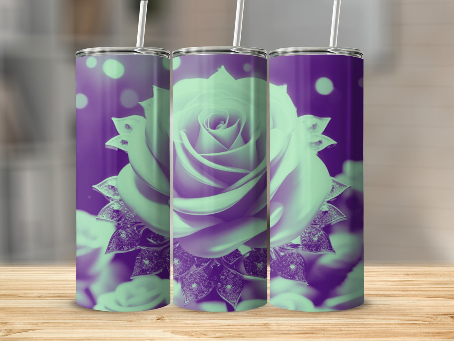 Three tall tumblers with a glowing purple rose design on a wooden surface.