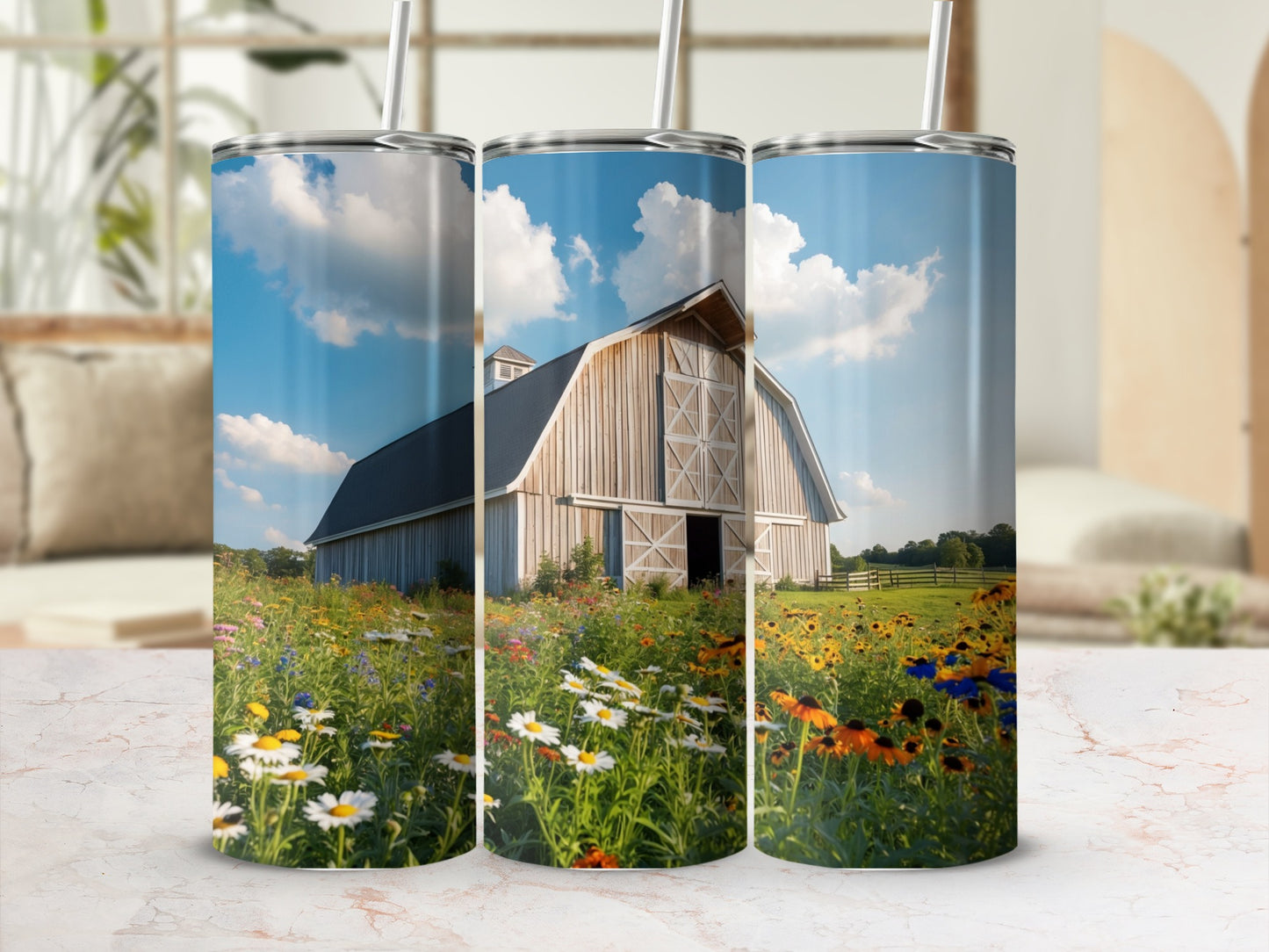 Barn with wildflowers under a blue sky, shown on three tumblers.