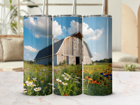 Barn with wildflowers under a blue sky, shown on three tumblers.