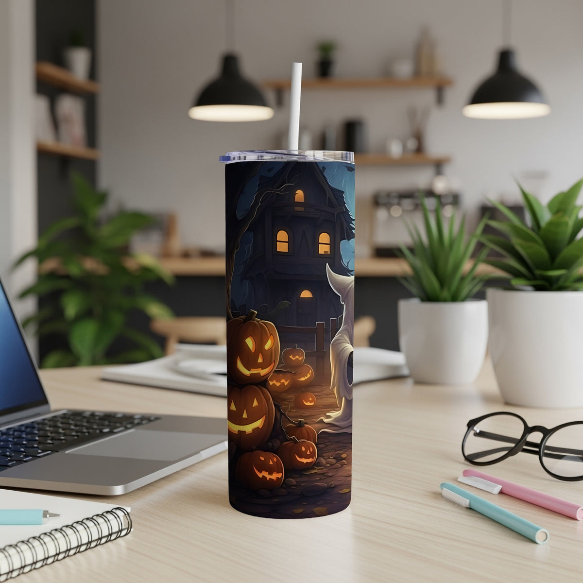 Tumbler with Halloween scene of jack-o'-lanterns, a haunted house, and a ghost.
