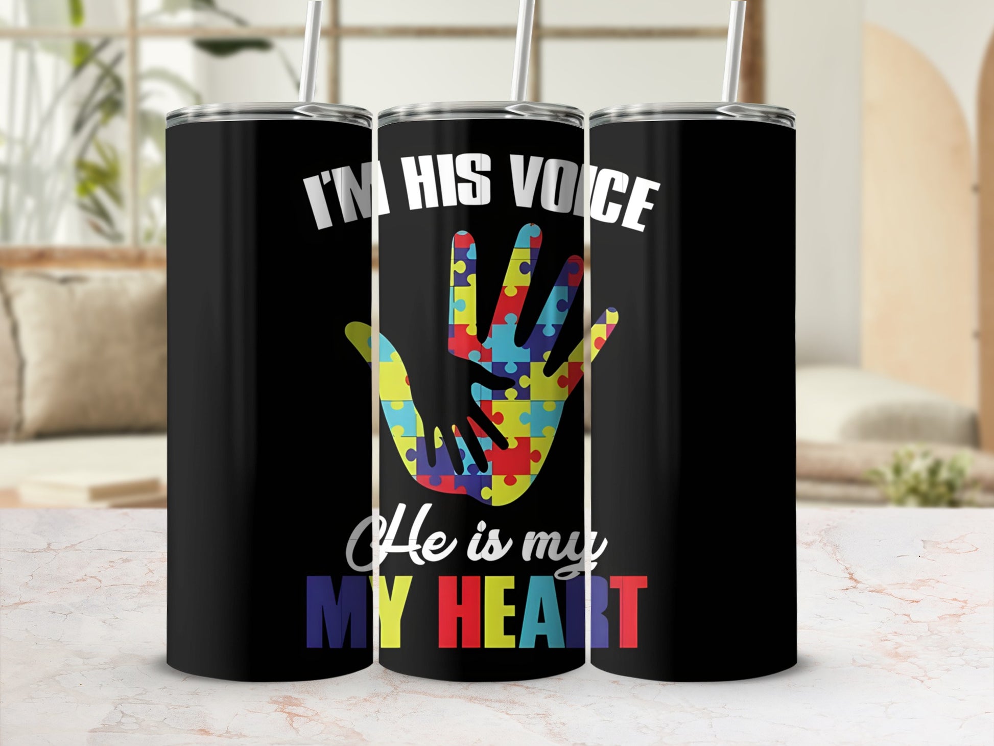 Black tumbler with "I'm His Voice, He is My Heart" and puzzle hand.