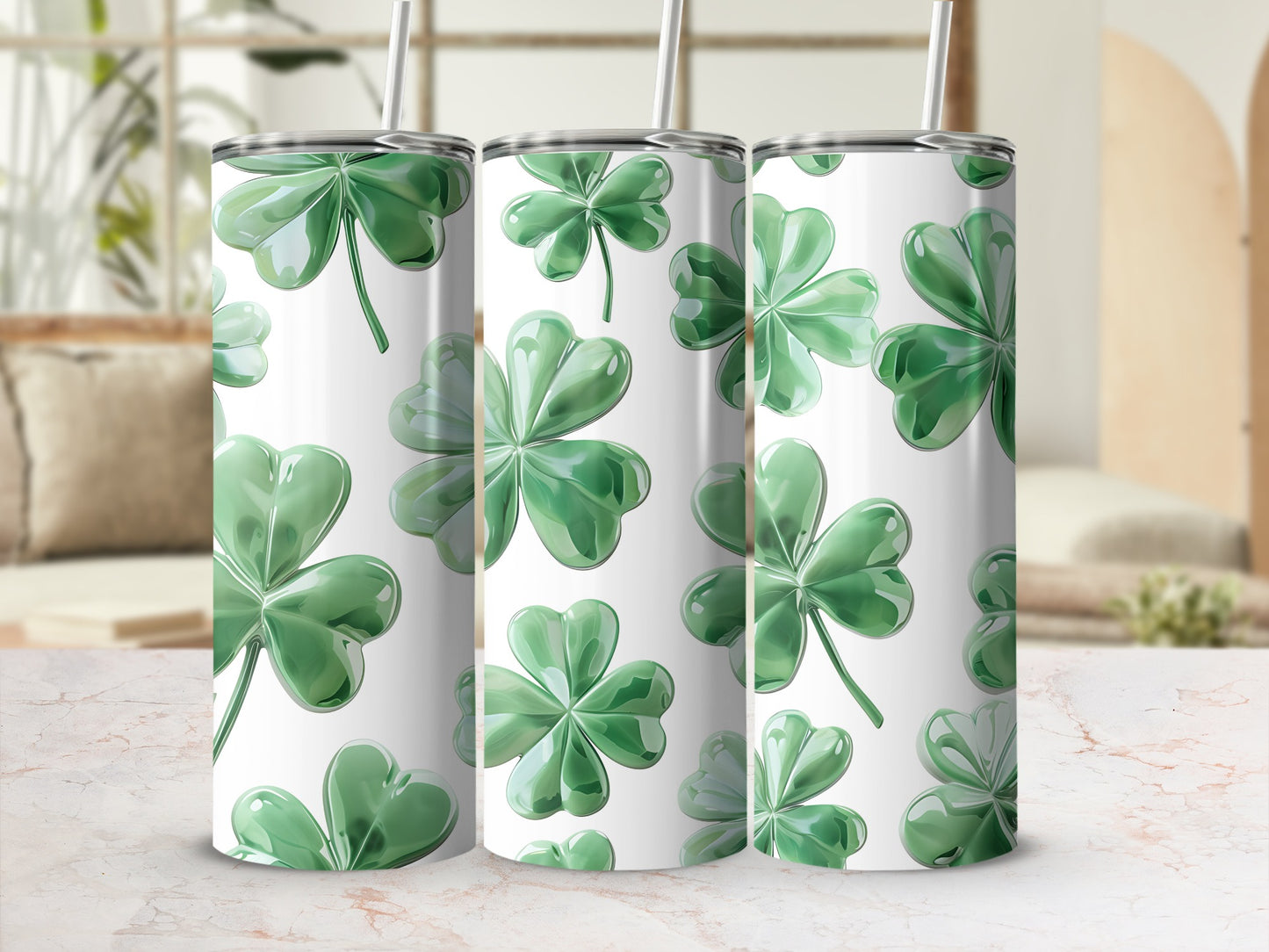 Three green shamrock tumblers with white backgrounds and straws.