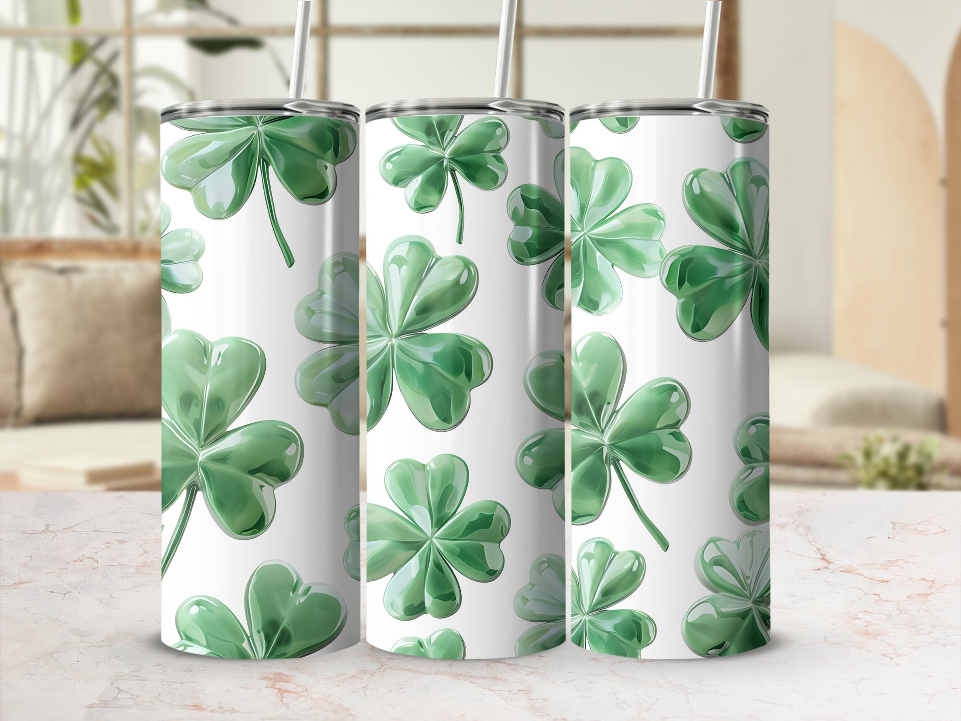 Three green shamrock tumblers with white backgrounds and straws.